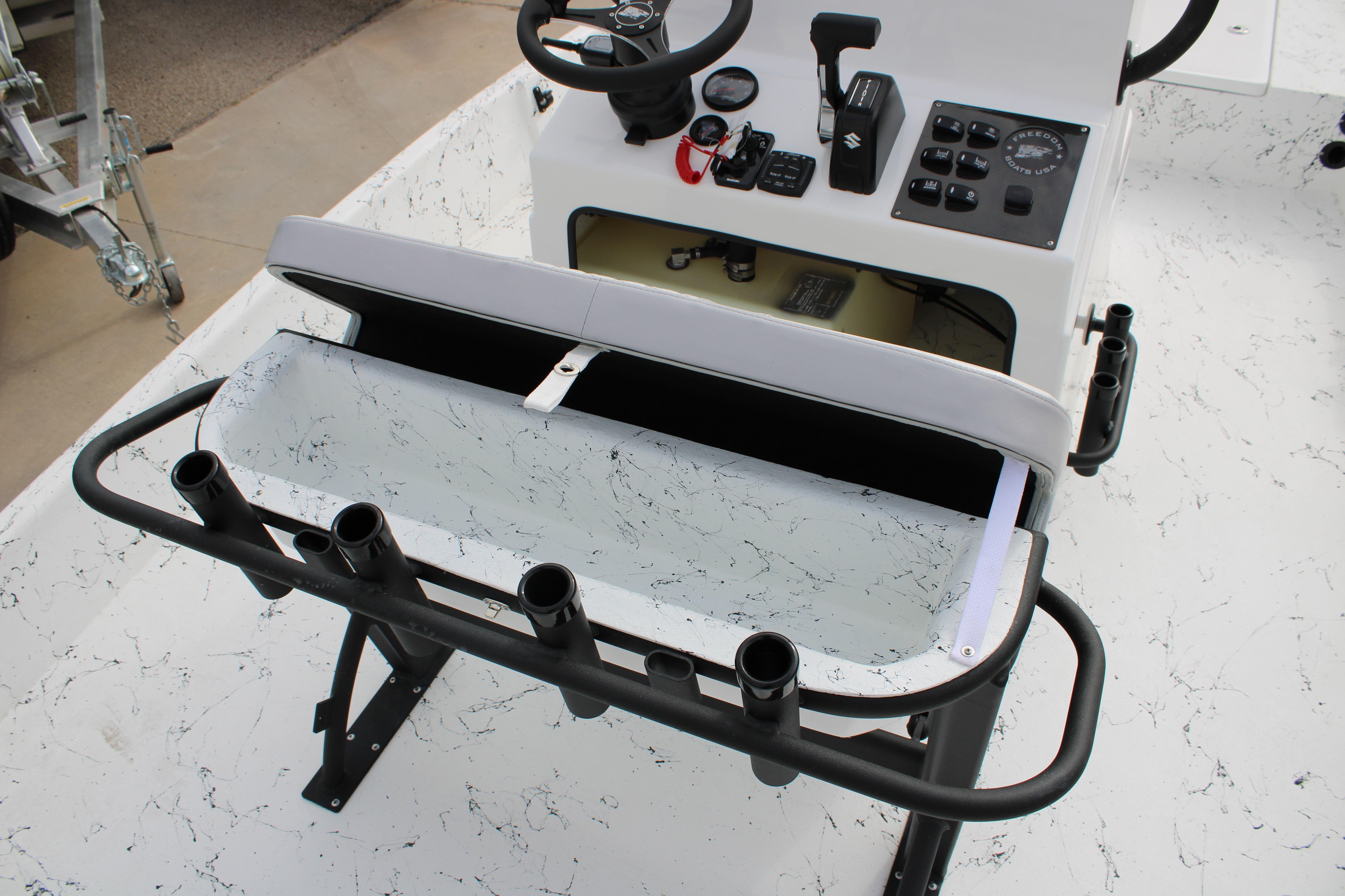 2026 Freedom Boats 19 PATRIOT console with steering wheel and rod holders.