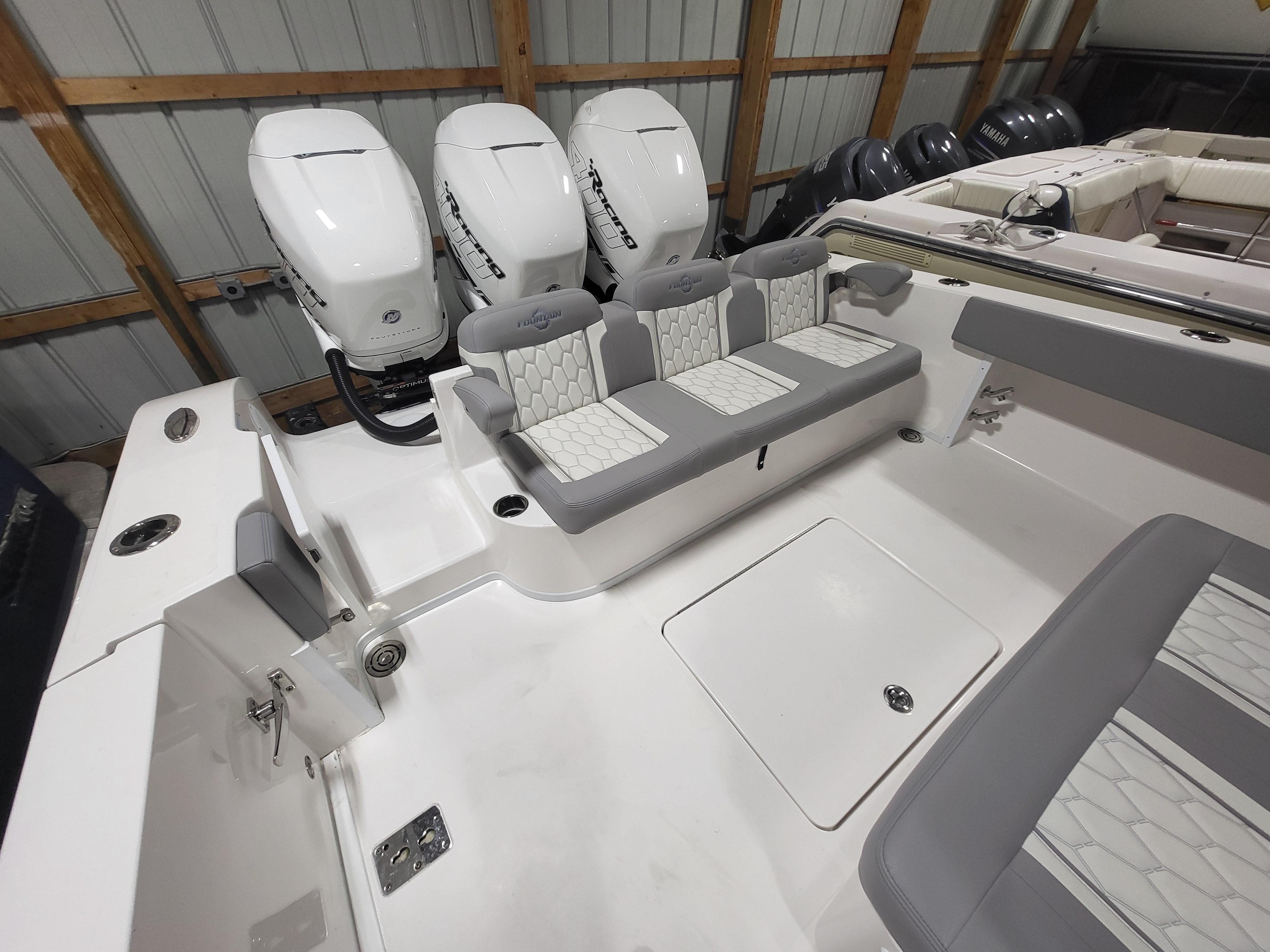 2022 Fountain 38 SC boat with triple outboard engines and spacious seating.