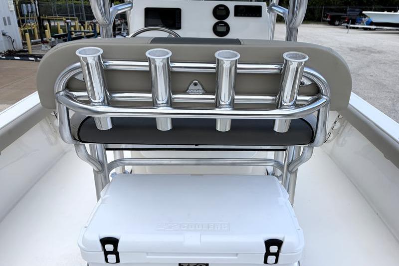 2025 Key West 210 Bay Reef boat with rod holders and cooler on deck.