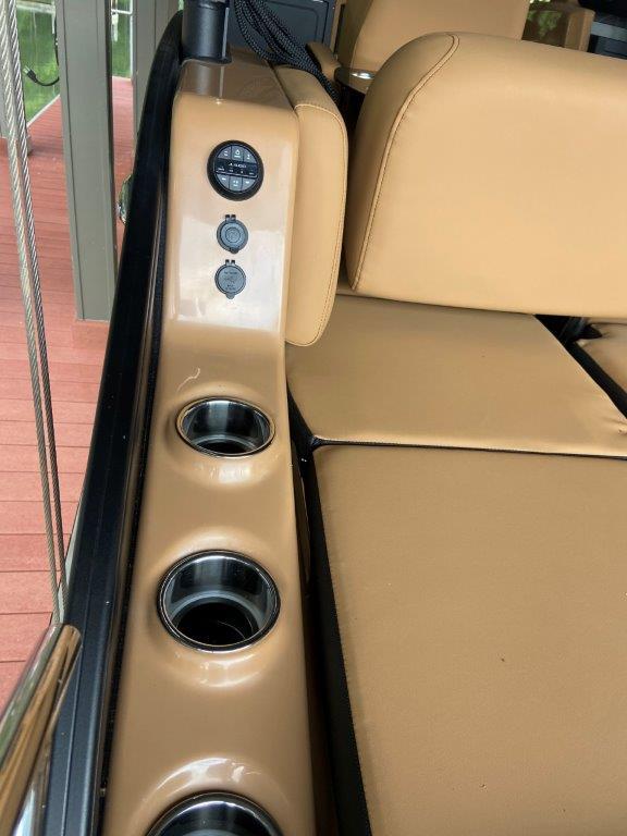 2023 Harris FloteBote 250 Grand Mariner interior with cup holders and beige seating.