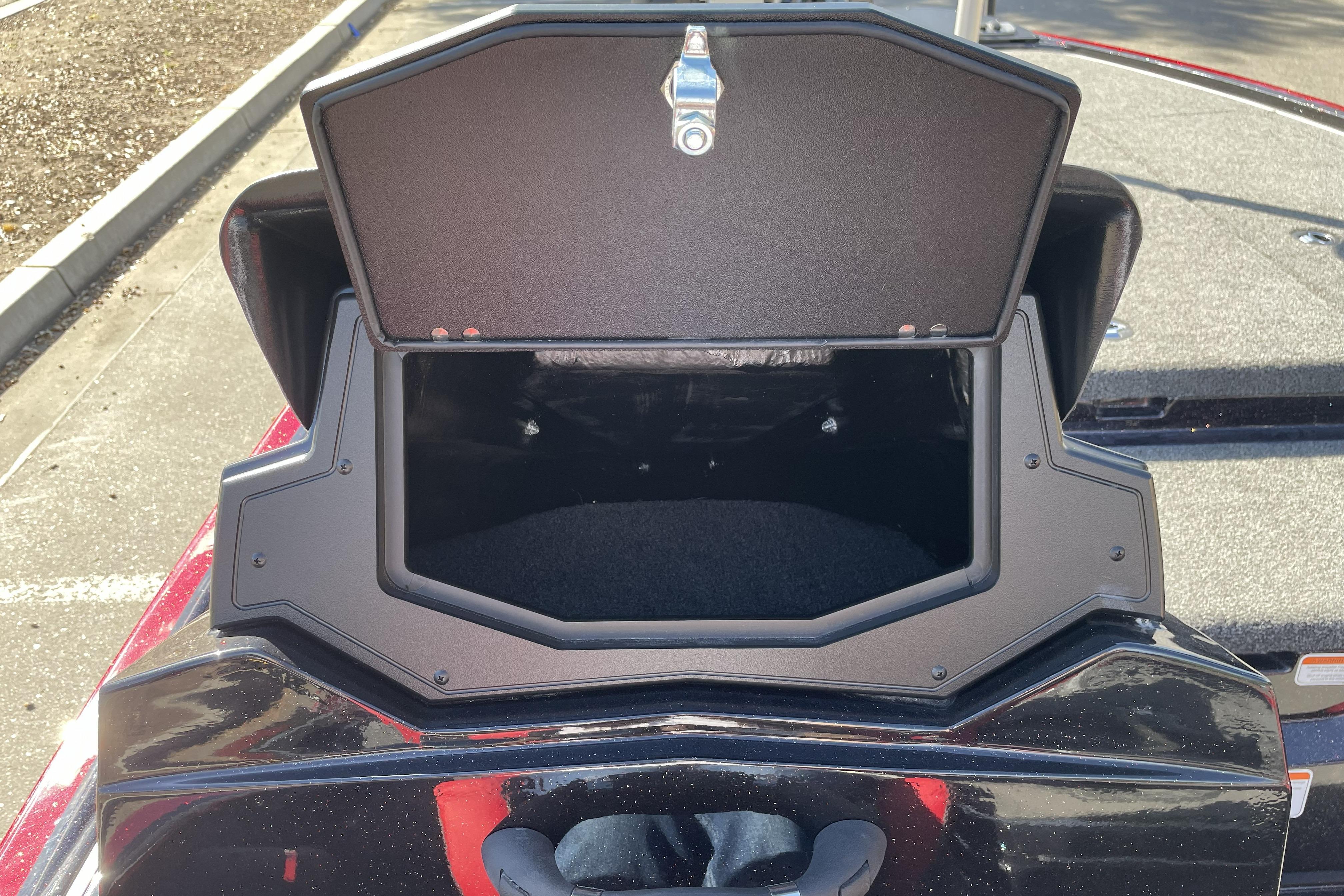 Open storage compartment on 2026 Nitro Z19 XL boat, showcasing interior space.