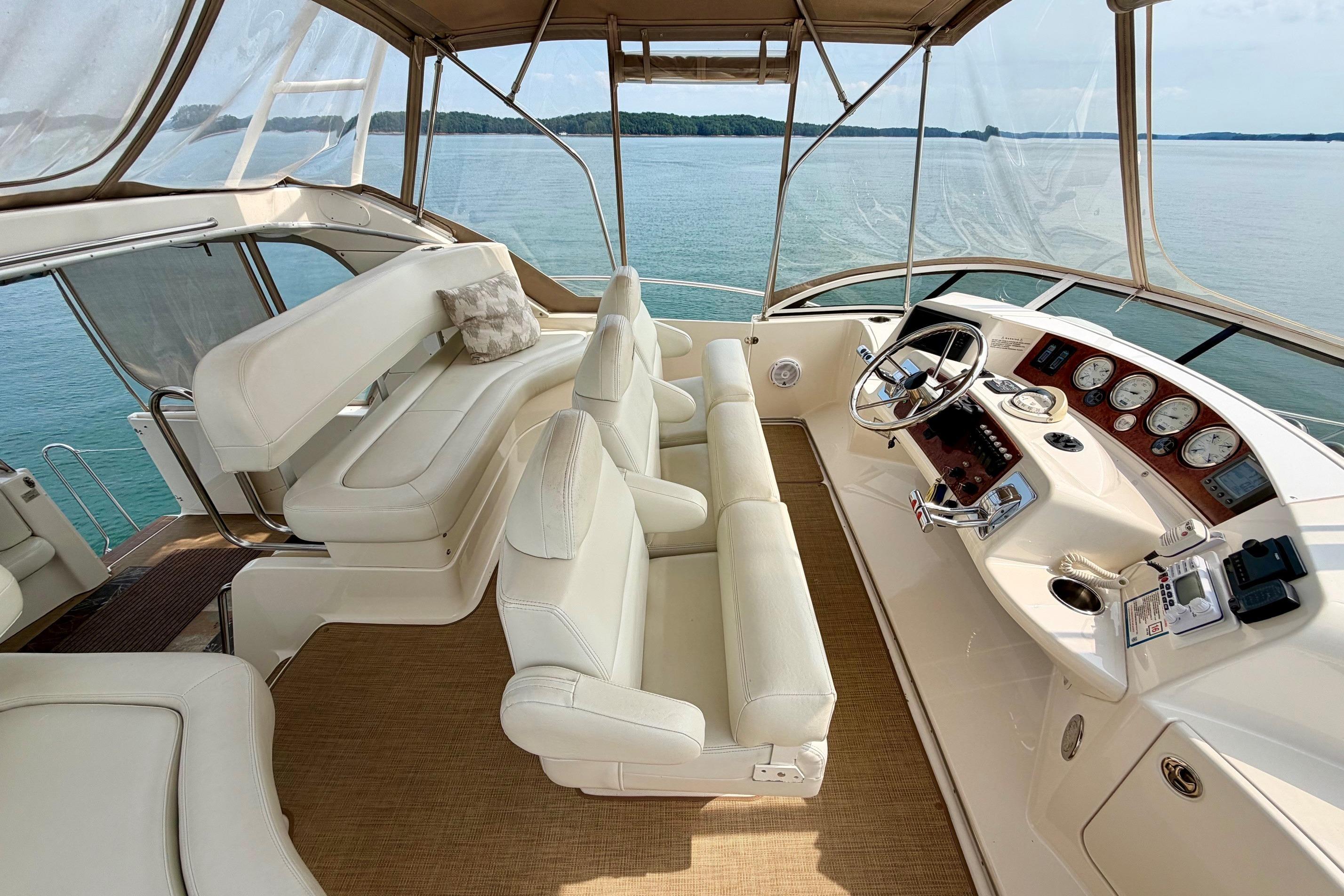 Luxurious 2004 Silverton 39 Motor Yacht interior with plush seating and scenic water view.