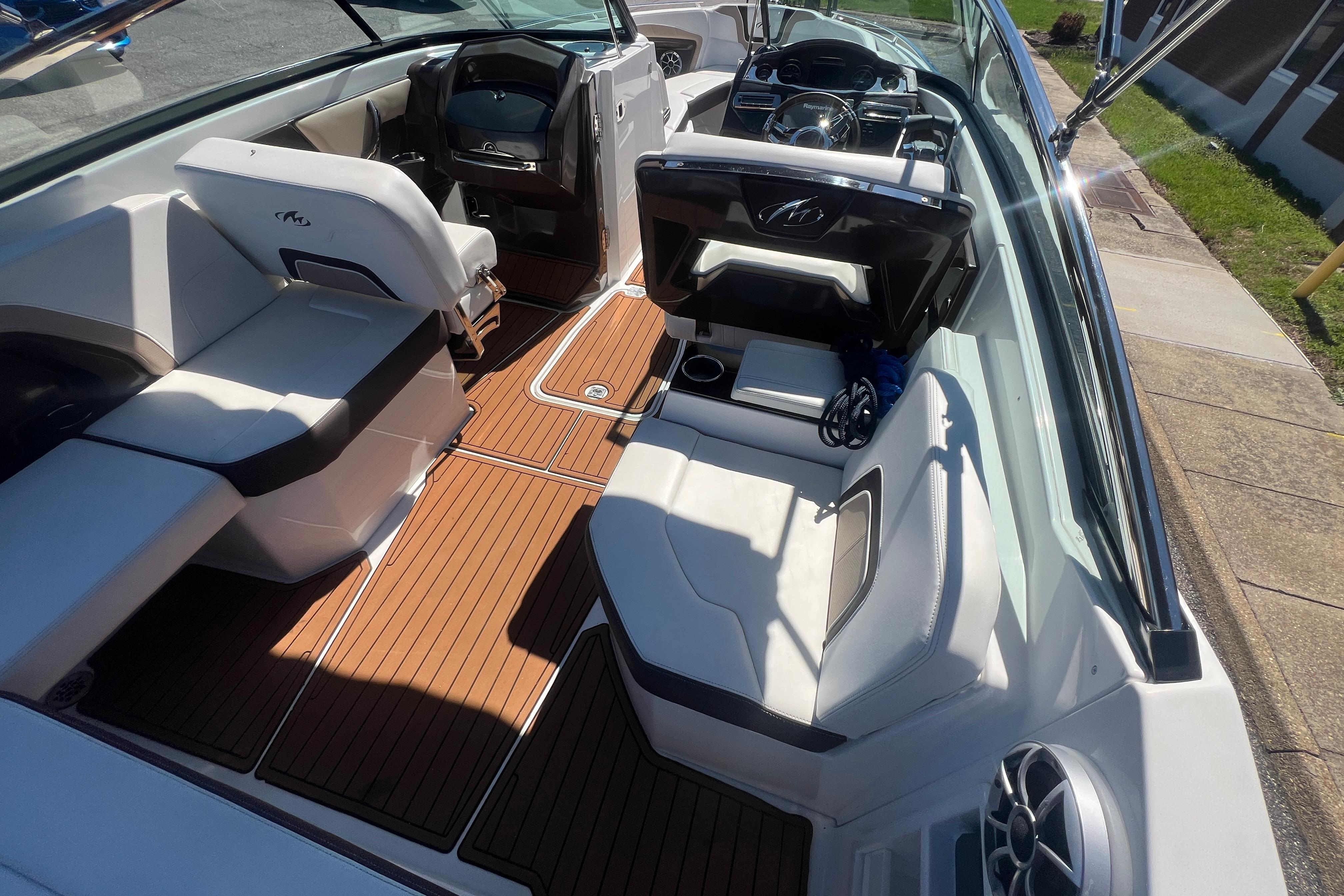 Interior of a 2017 Monterey 298SS Super Sport boat with sleek seating and wood flooring.
