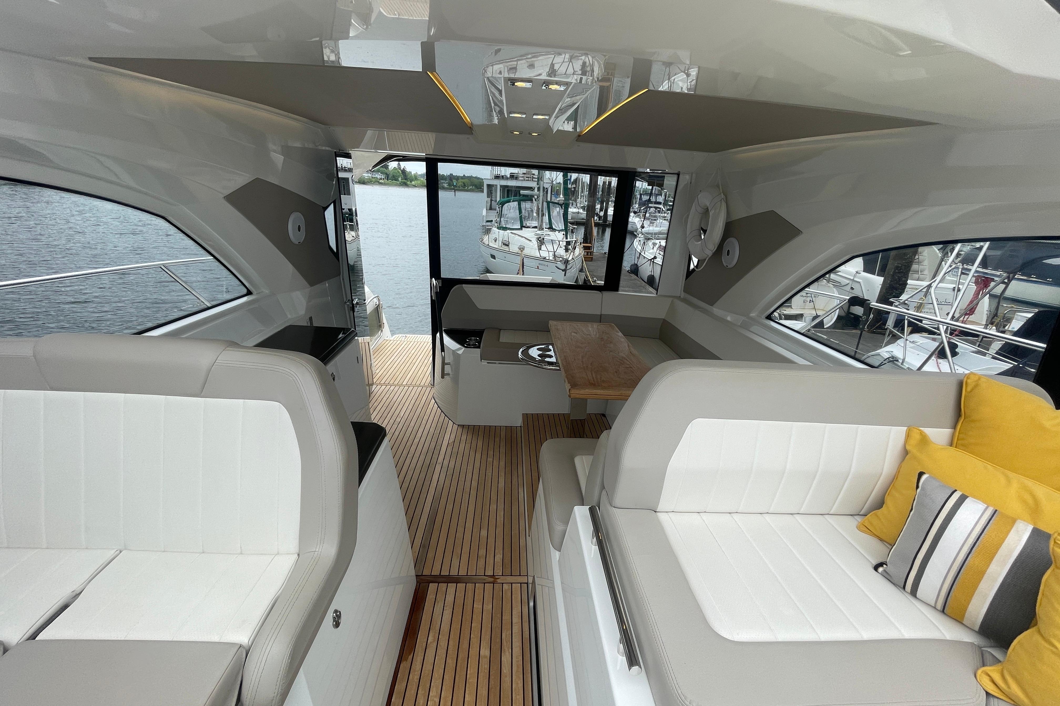 Interior of 2017 Jeanneau Leader 46 yacht with elegant seating and wooden flooring