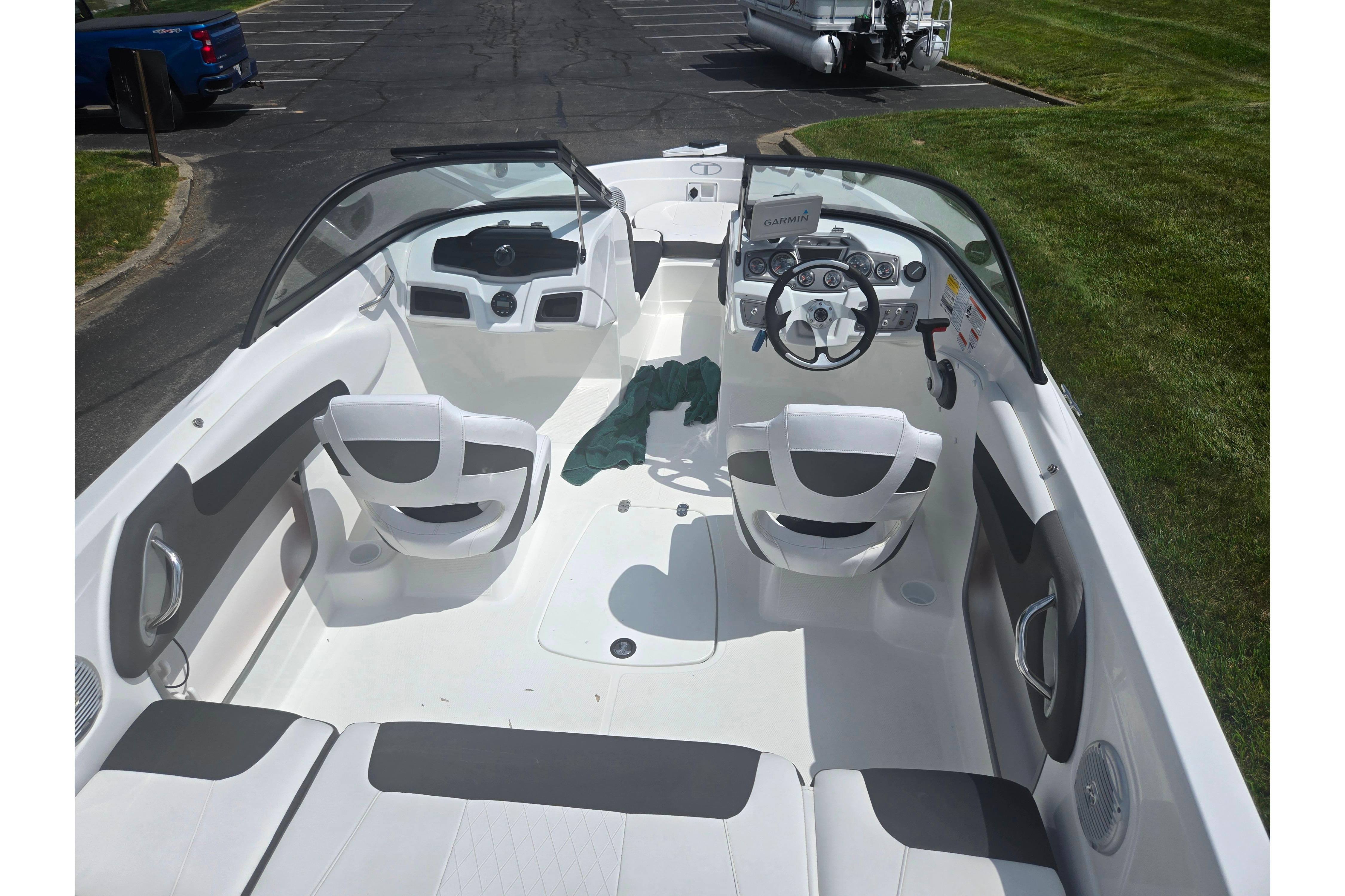 2023 Tahoe 200 S boat interior with white seating and steering console.