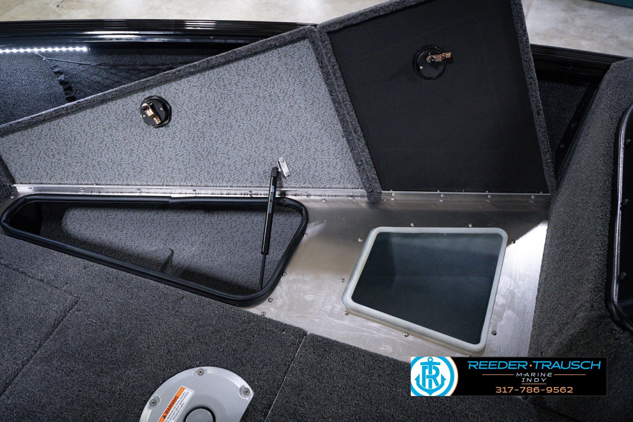 Interior view of 2026 Lund 1875 Impact XS SS boat storage compartments.