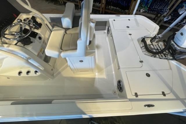 2026 Mako 24 APEX boat interior with steering console and seating.