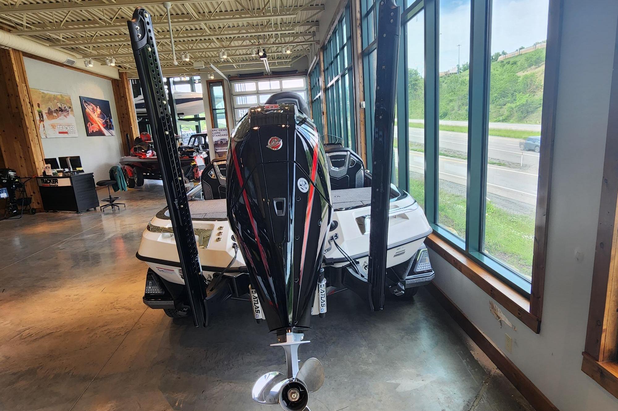2026 Ranger Z520R boat displayed indoors, showcasing sleek design and powerful engine.