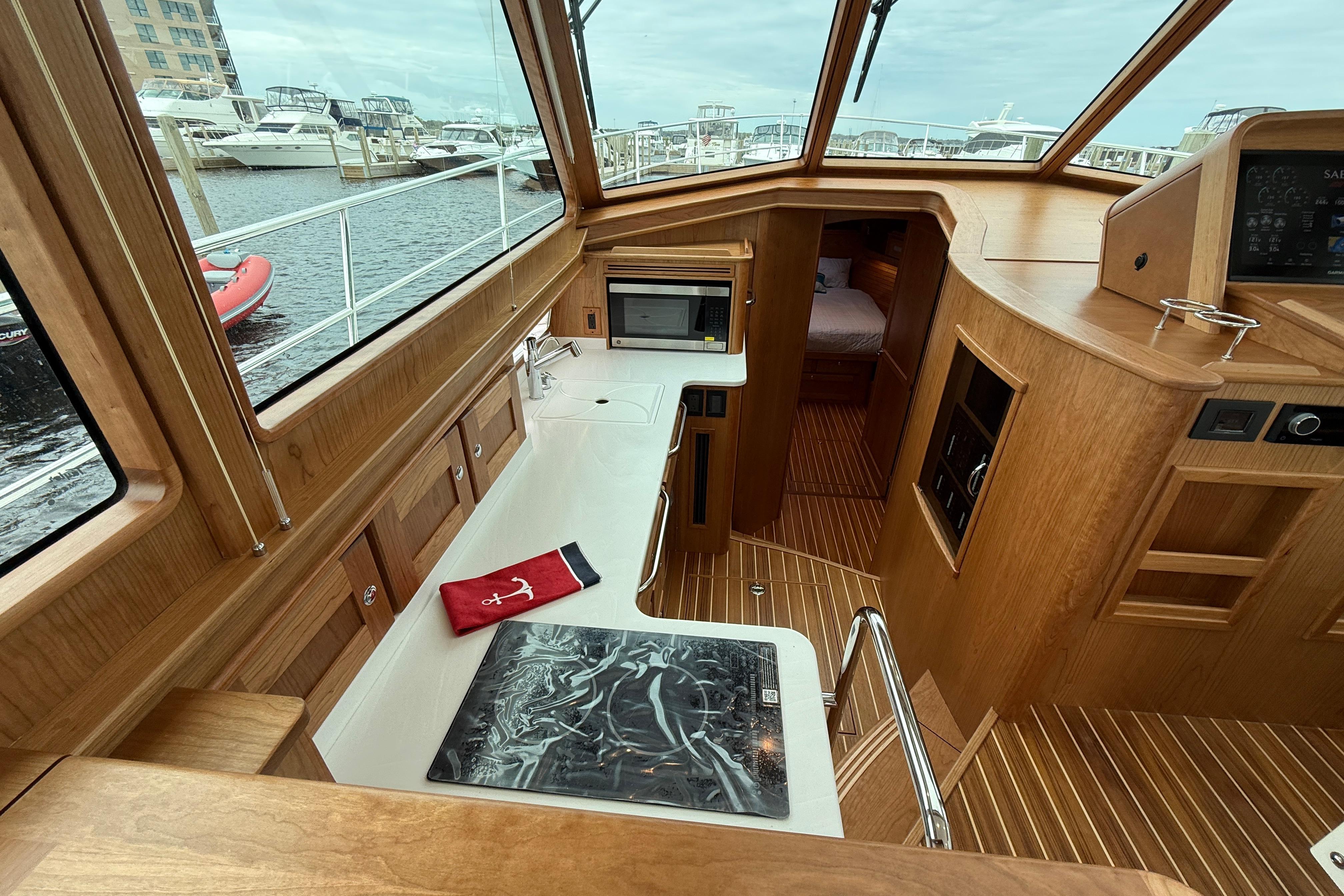 Luxurious interior of 2026 Sabre 45 Salon Express yacht with wood finish and modern amenities.