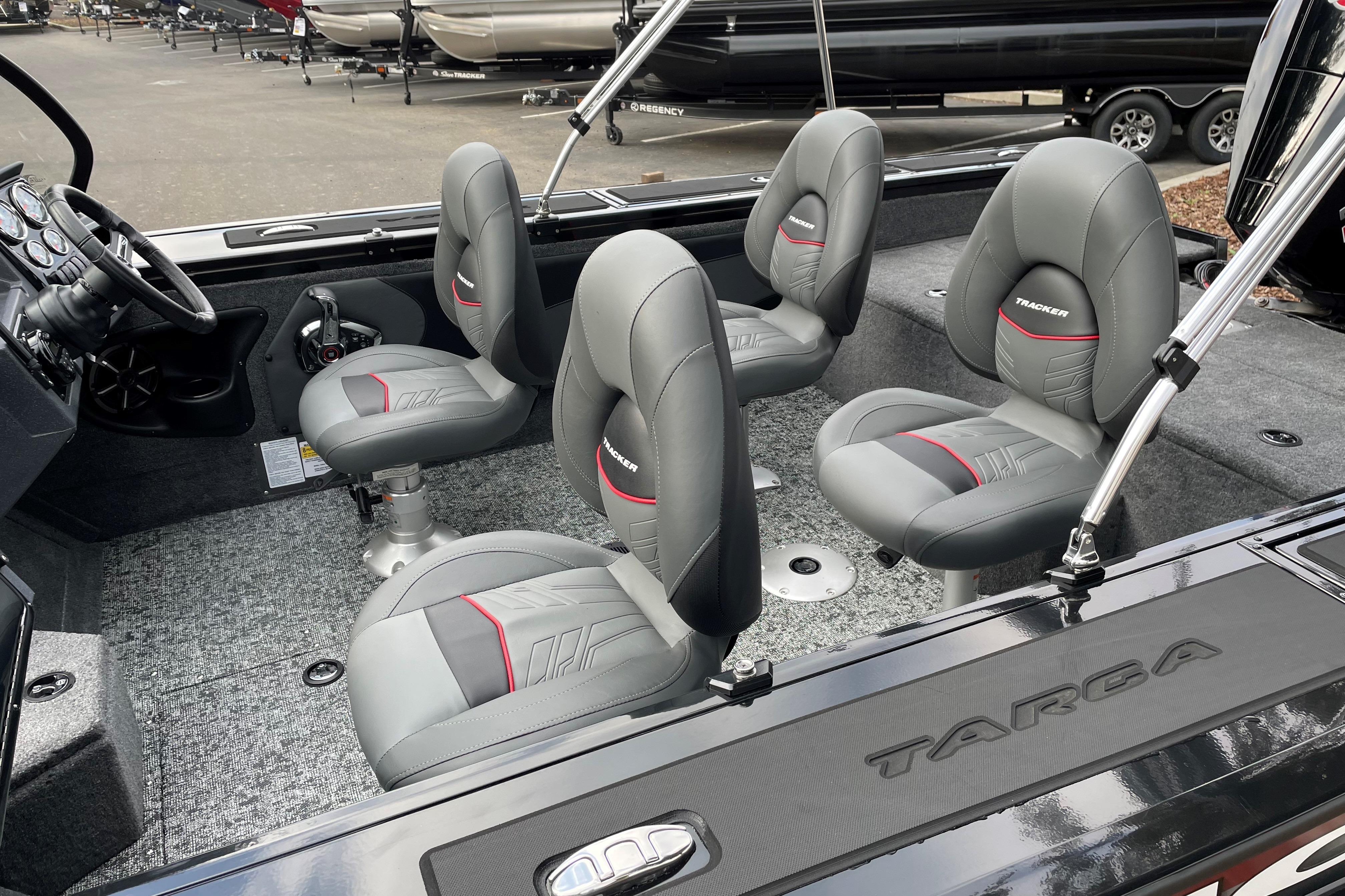 2026 Tracker Targa V-19 WT boat interior with four gray seats and steering console.