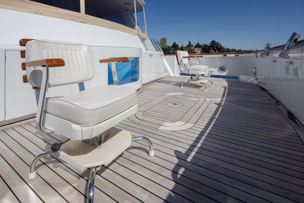 1989 Delta Marine Flybridge Motoryacht with elegant deck chairs.