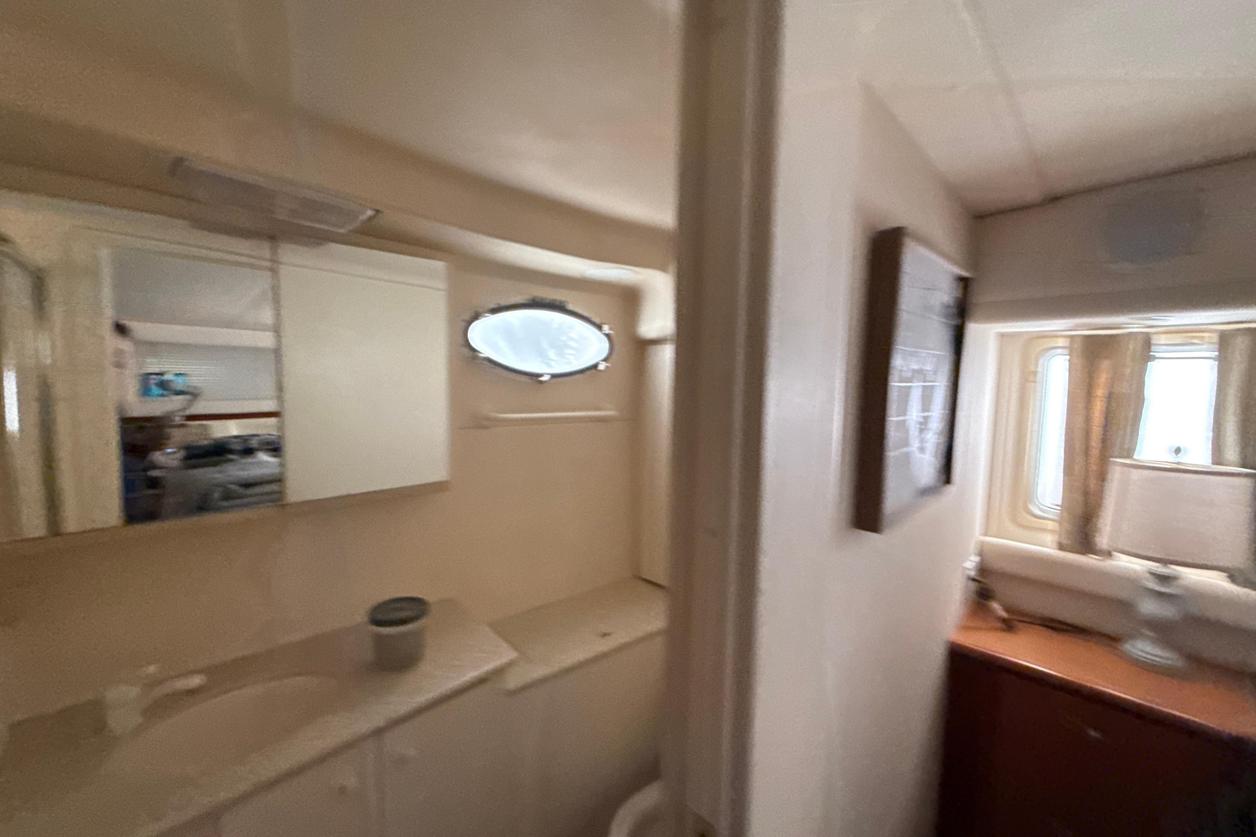 Interior of 1999 Silverton 422 Motor Yacht showing bathroom and window area.