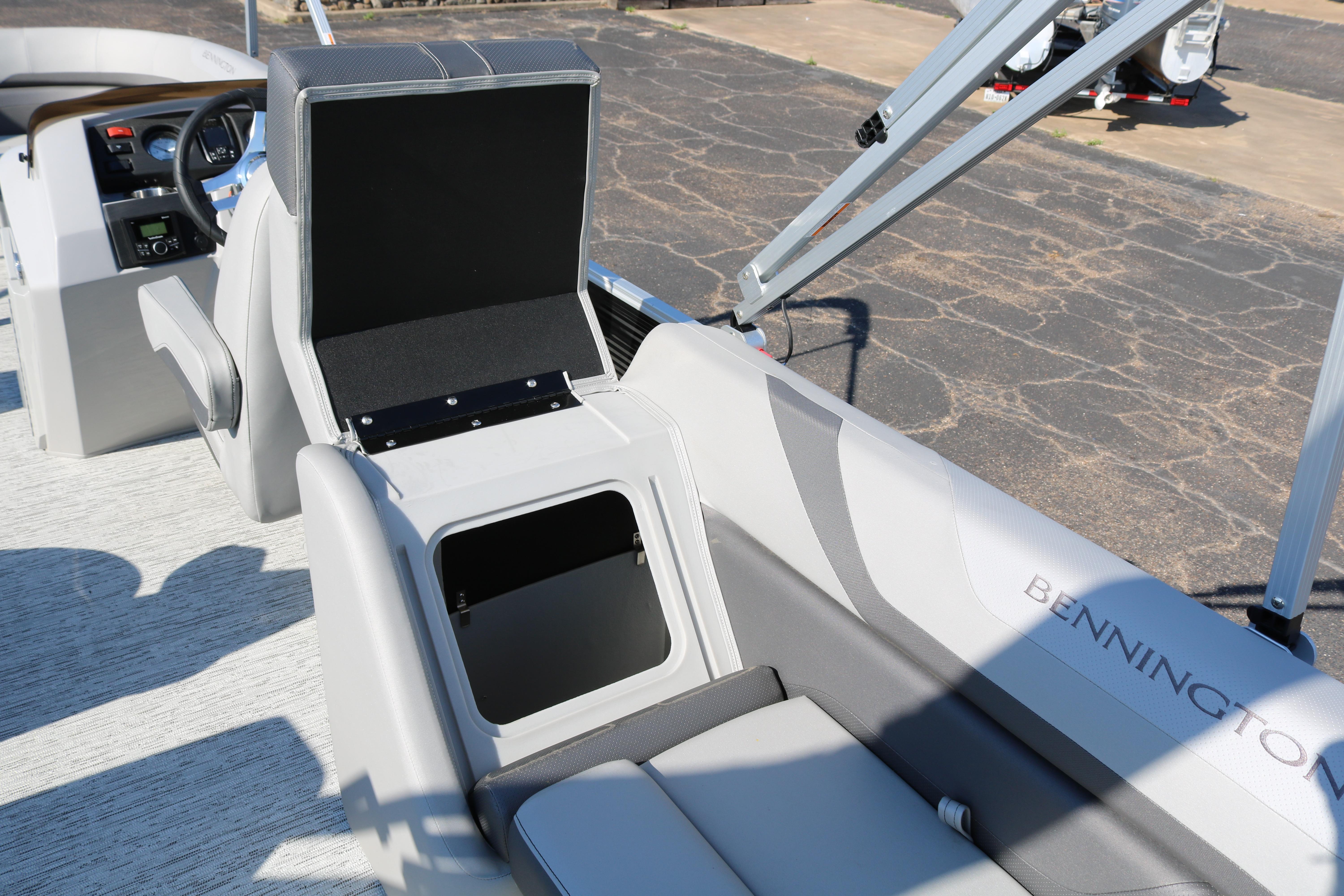 2026 Bennington 22SX Stern Radius boat interior with open storage compartment.