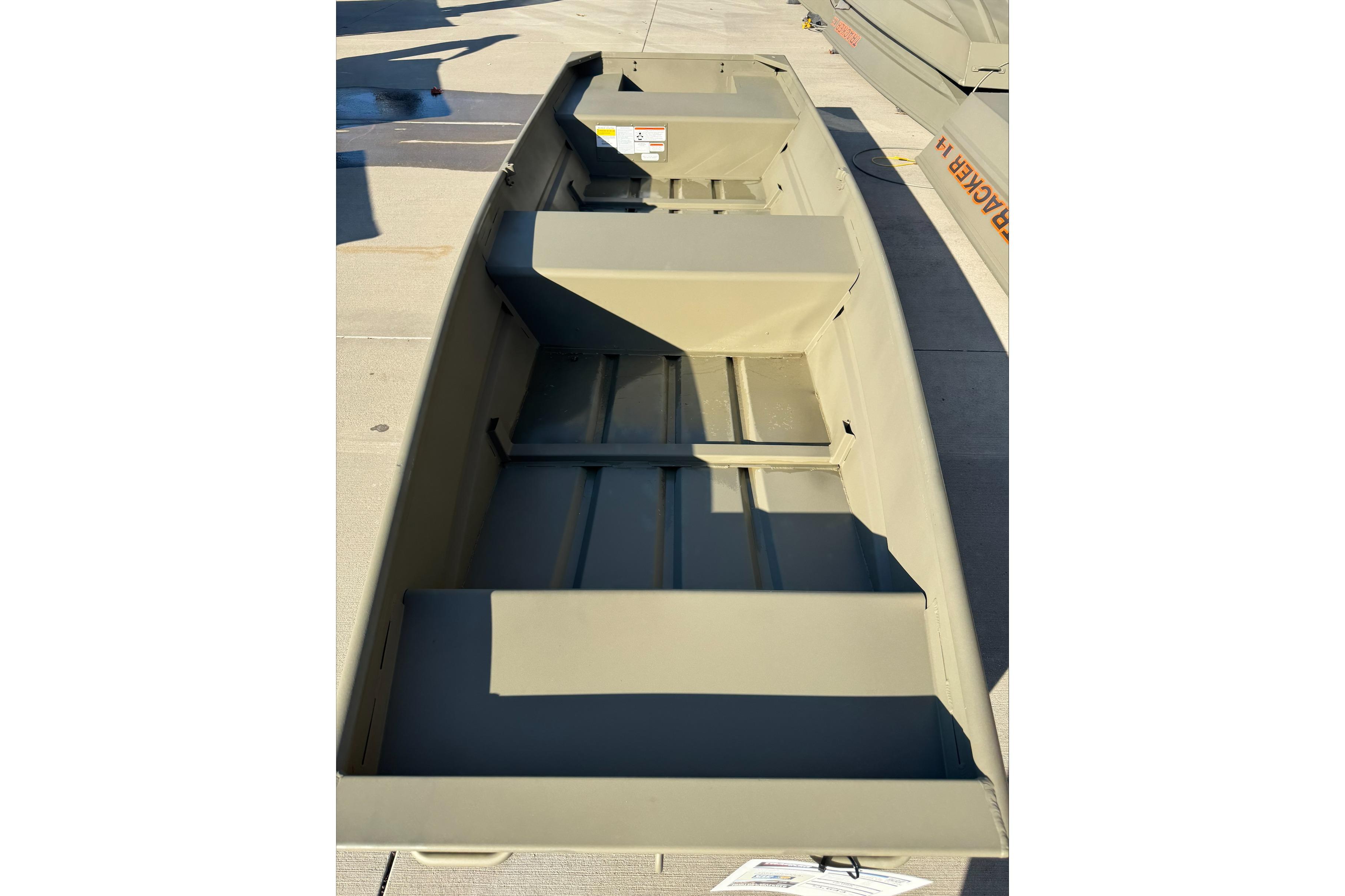 2026 Tracker Grizzly 14 Jon boat, interior view, showcasing seating and storage layout.