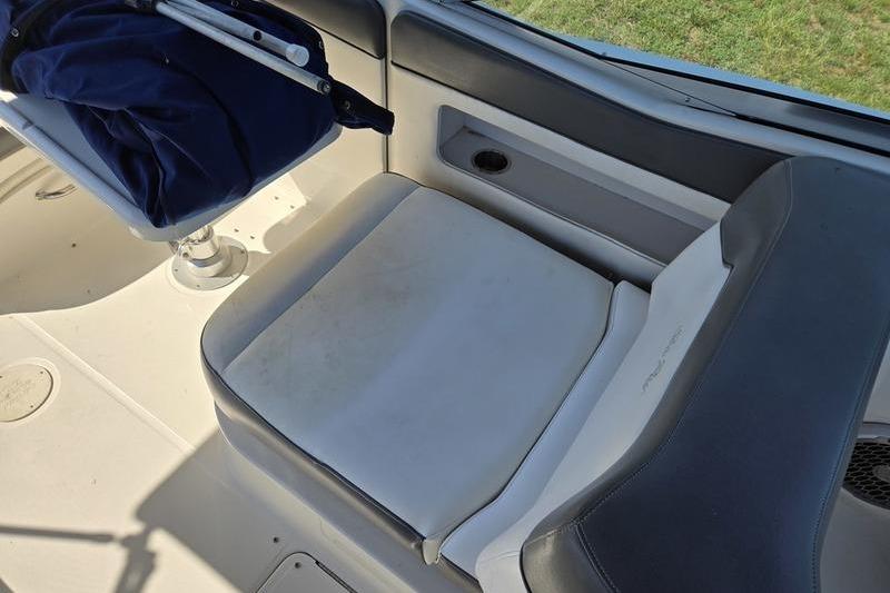2011 Sea Ray 300 Sundeck interior seating with gray and white upholstery.