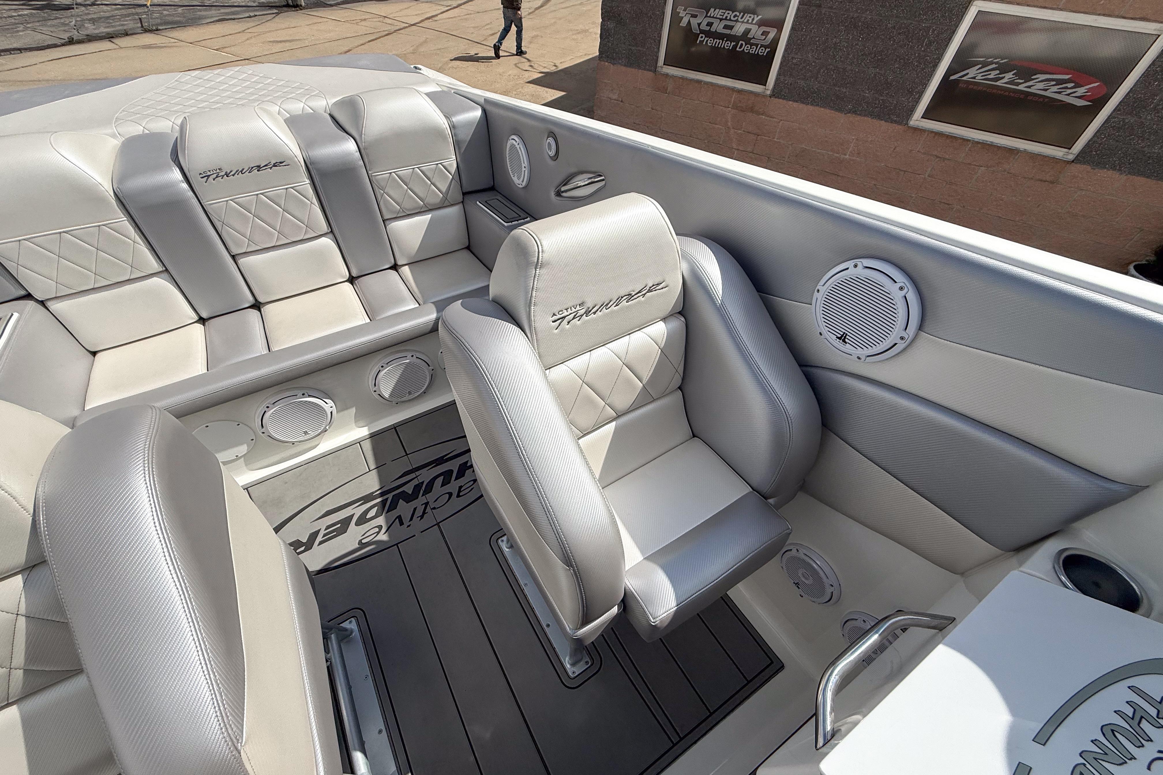 Interior of a 2002 Active Thunder 37 boat with luxurious seating and sleek design.