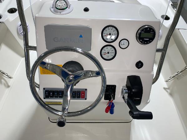 Steering console of 2026 Key West 188 Bay Reef boat with gauges and controls.