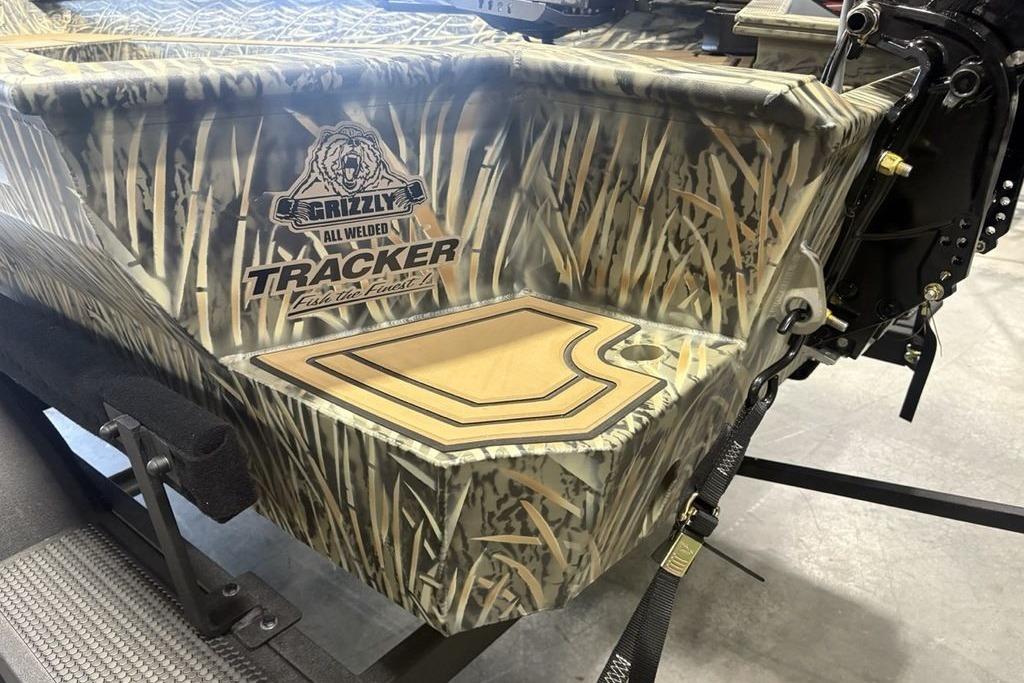 2026 Tracker Grizzly 1650 T Prairie Wings Edition boat with camo design and logo.