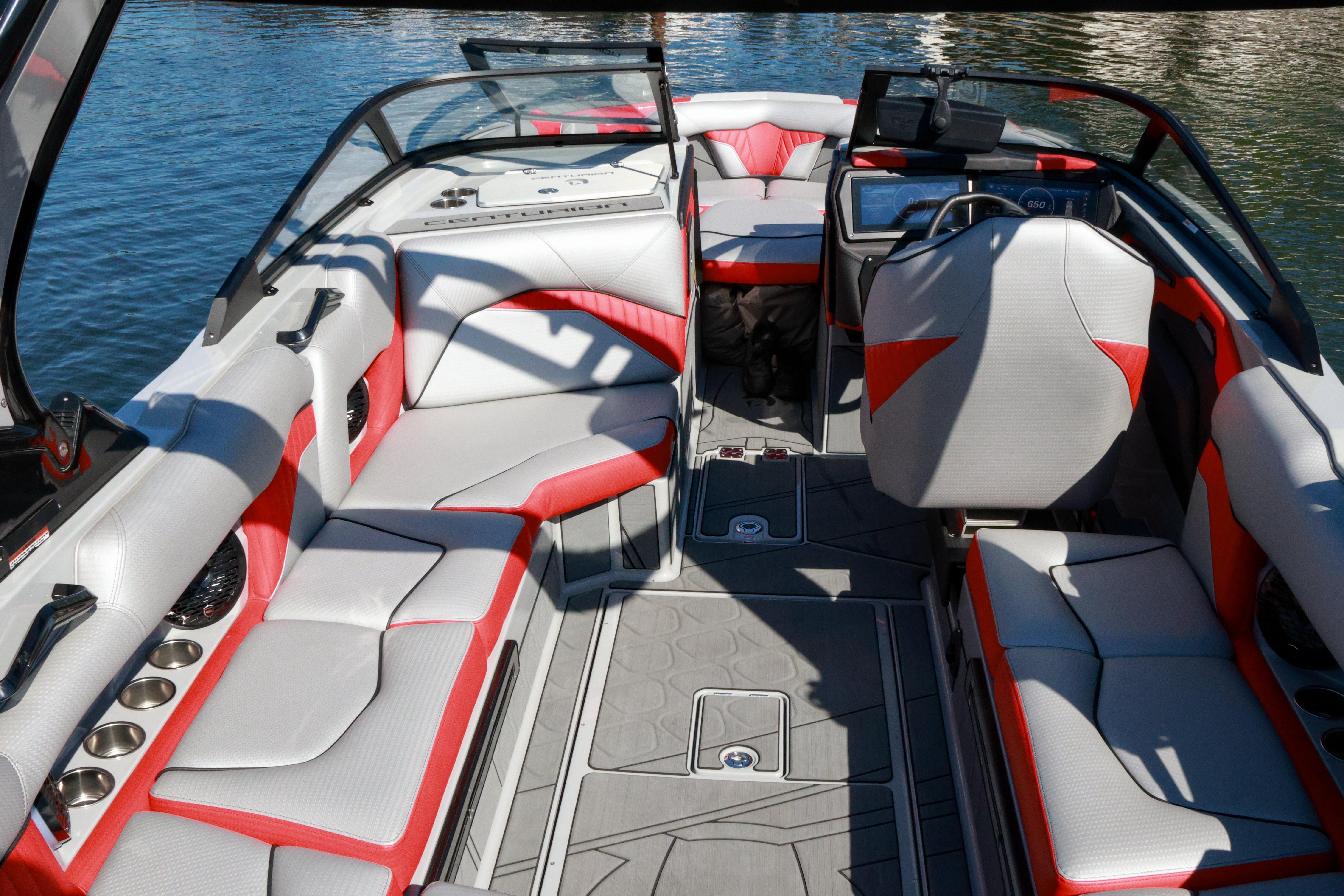 2024 Centurion Fi23 boat interior with red and white seating, sleek design, and modern dashboard.