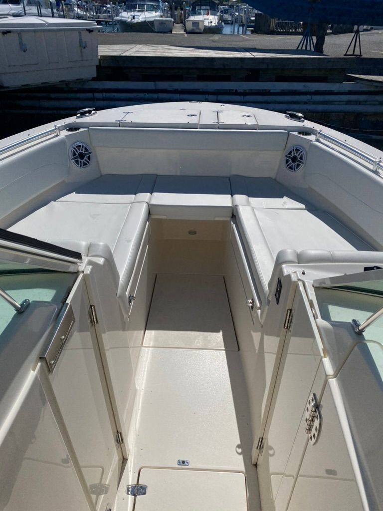 Interior view of 2023 Cobia 330 boat deck at the marina.