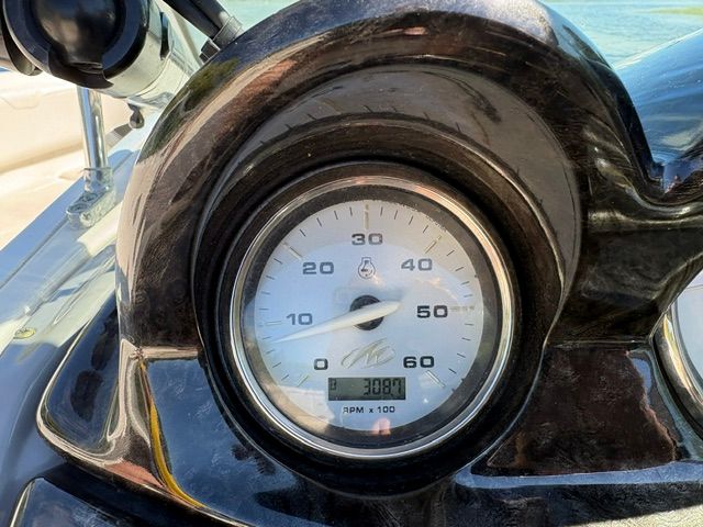 Close-up of a boat tachometer, displaying 308 hours.