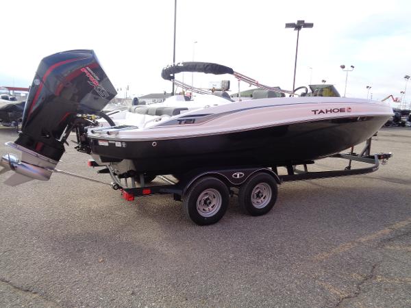 2024 Tahoe T21 boat on trailer with outboard motor.