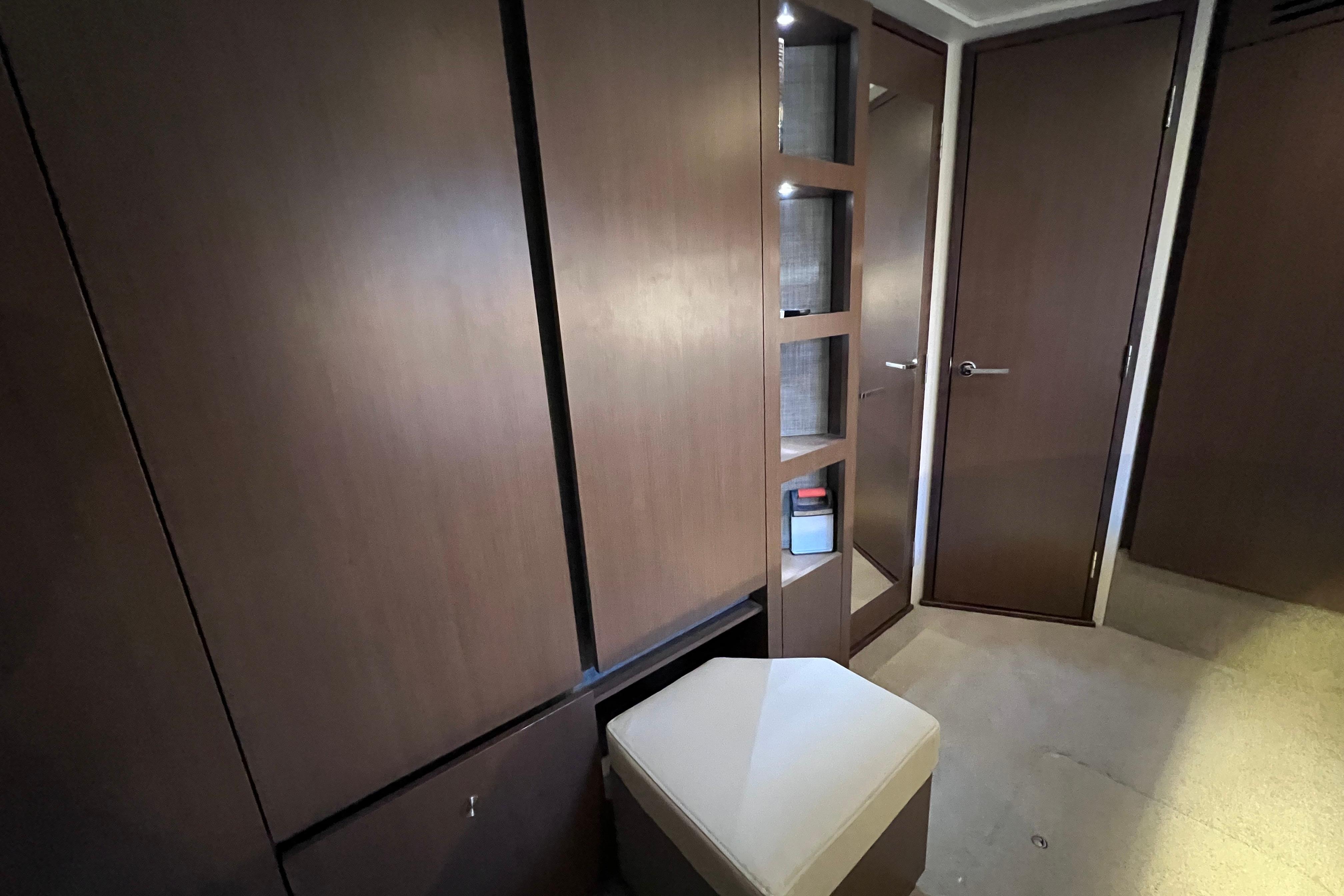 2017 Sea Ray Sundancer 400 interior with wooden cabinets and seating.