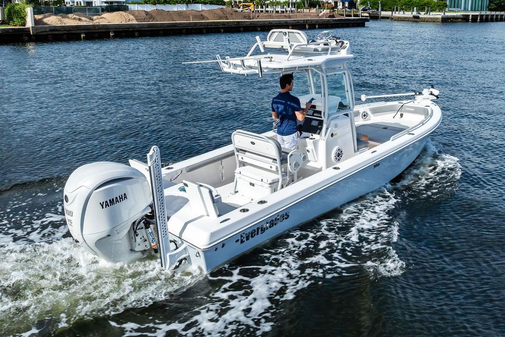 2023 Everglades 243 Center Console boat cruising on water with Yamaha engine.