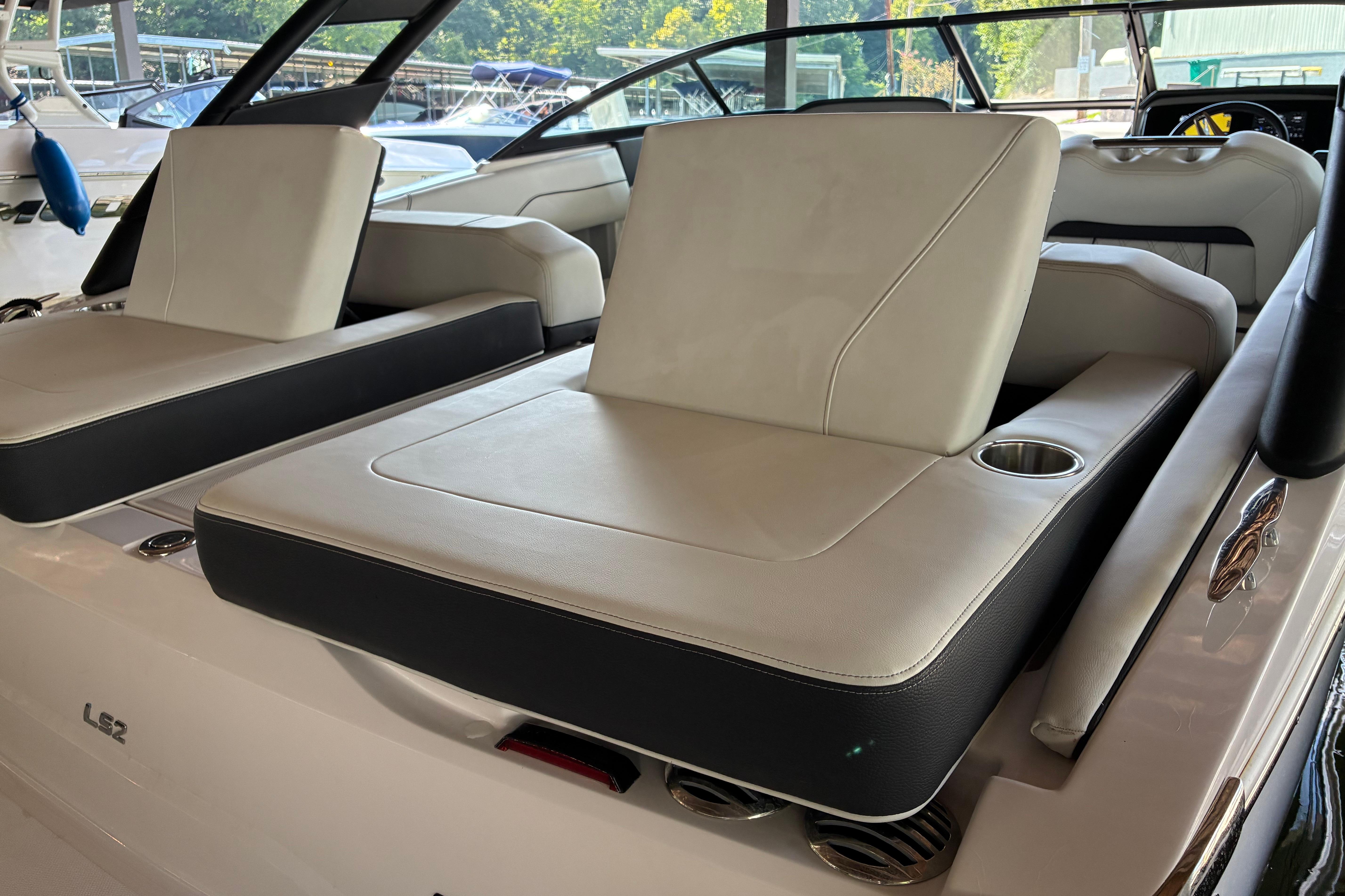 2025 Regal LS2 boat interior with luxurious seating and cup holders.