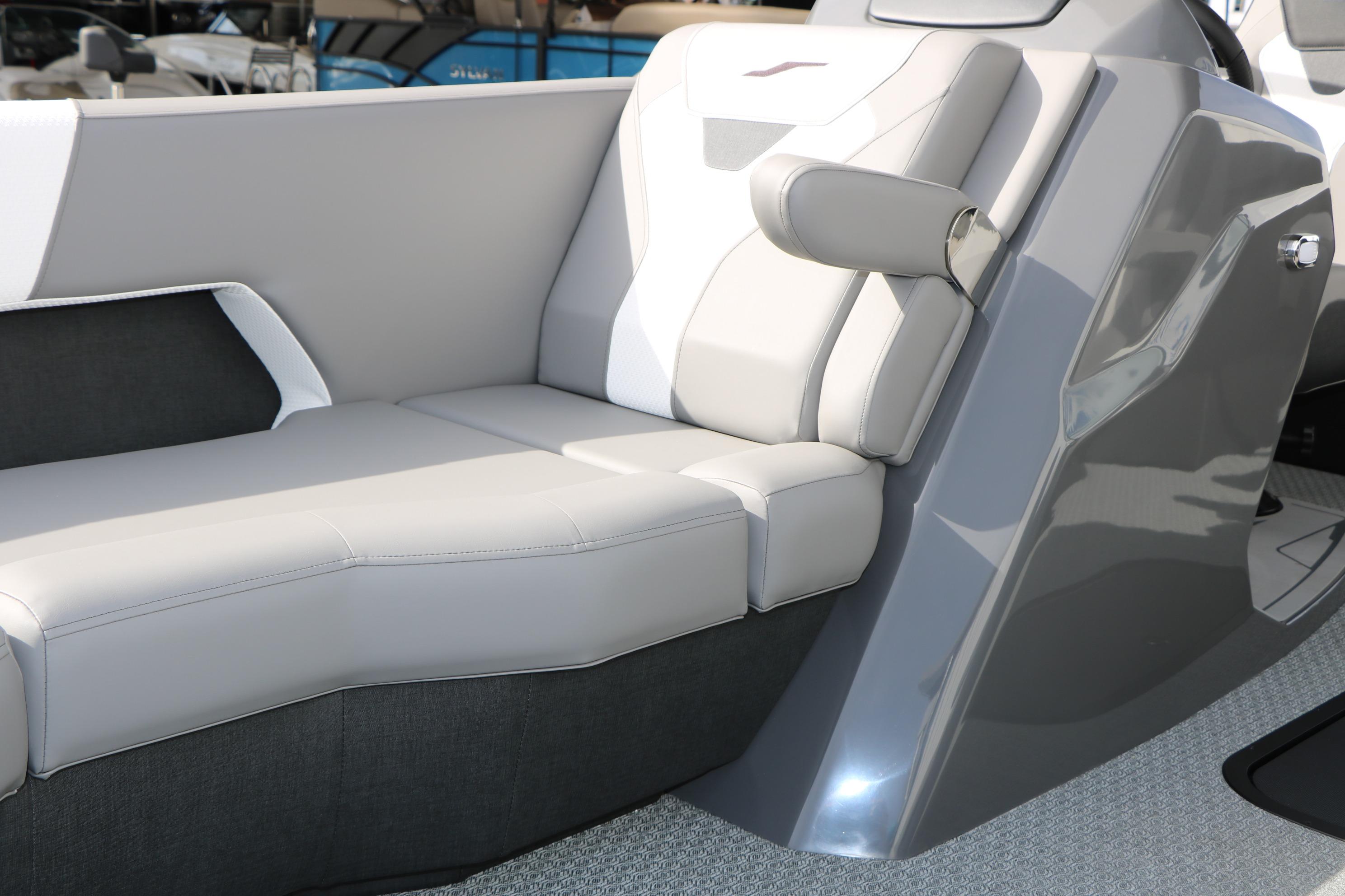 Luxurious seating in the 2026 Evotti 521QL boat, featuring sleek gray and white upholstery.