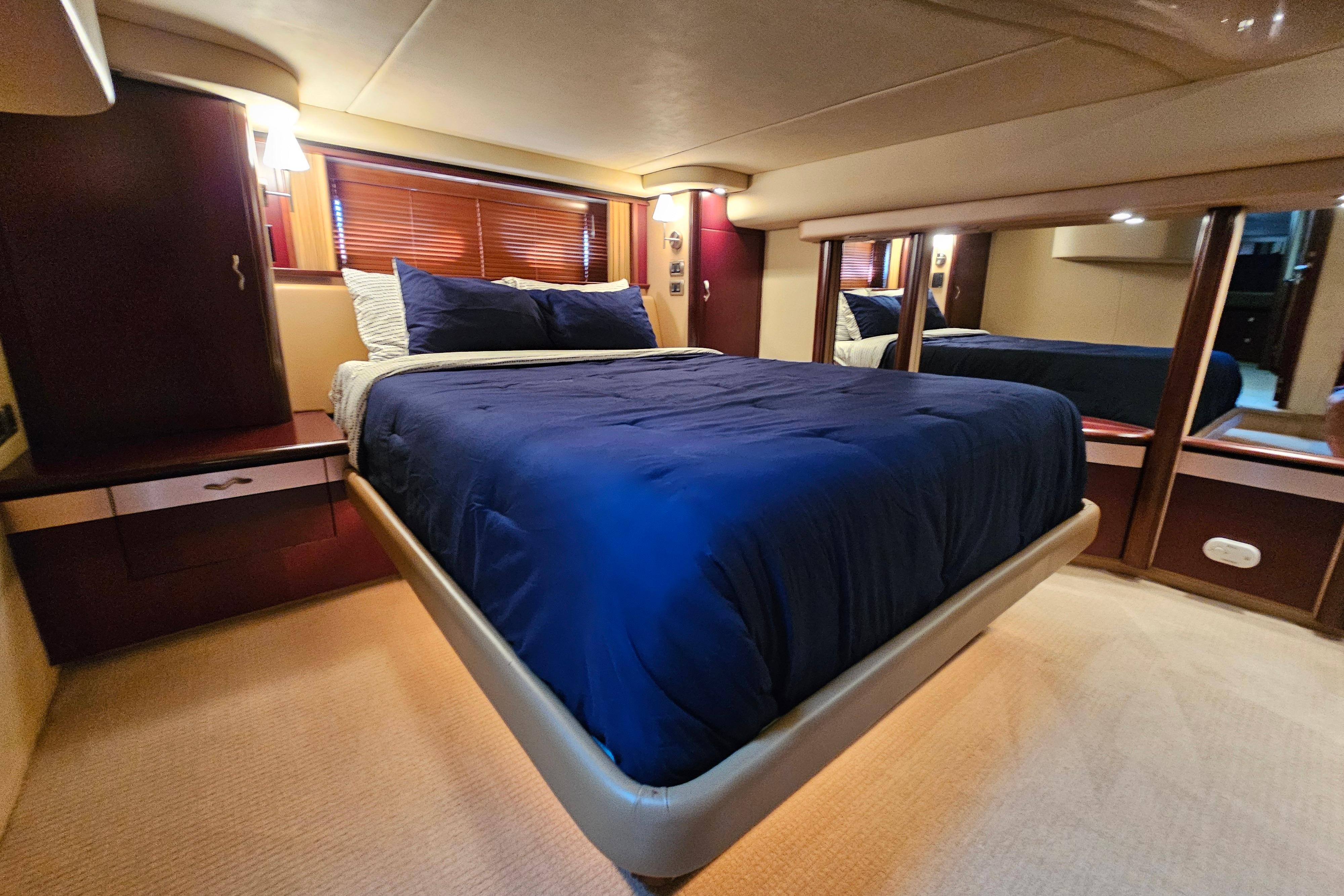 Luxurious bedroom interior of 2006 Sea Ray 580 Sedan Bridge yacht.