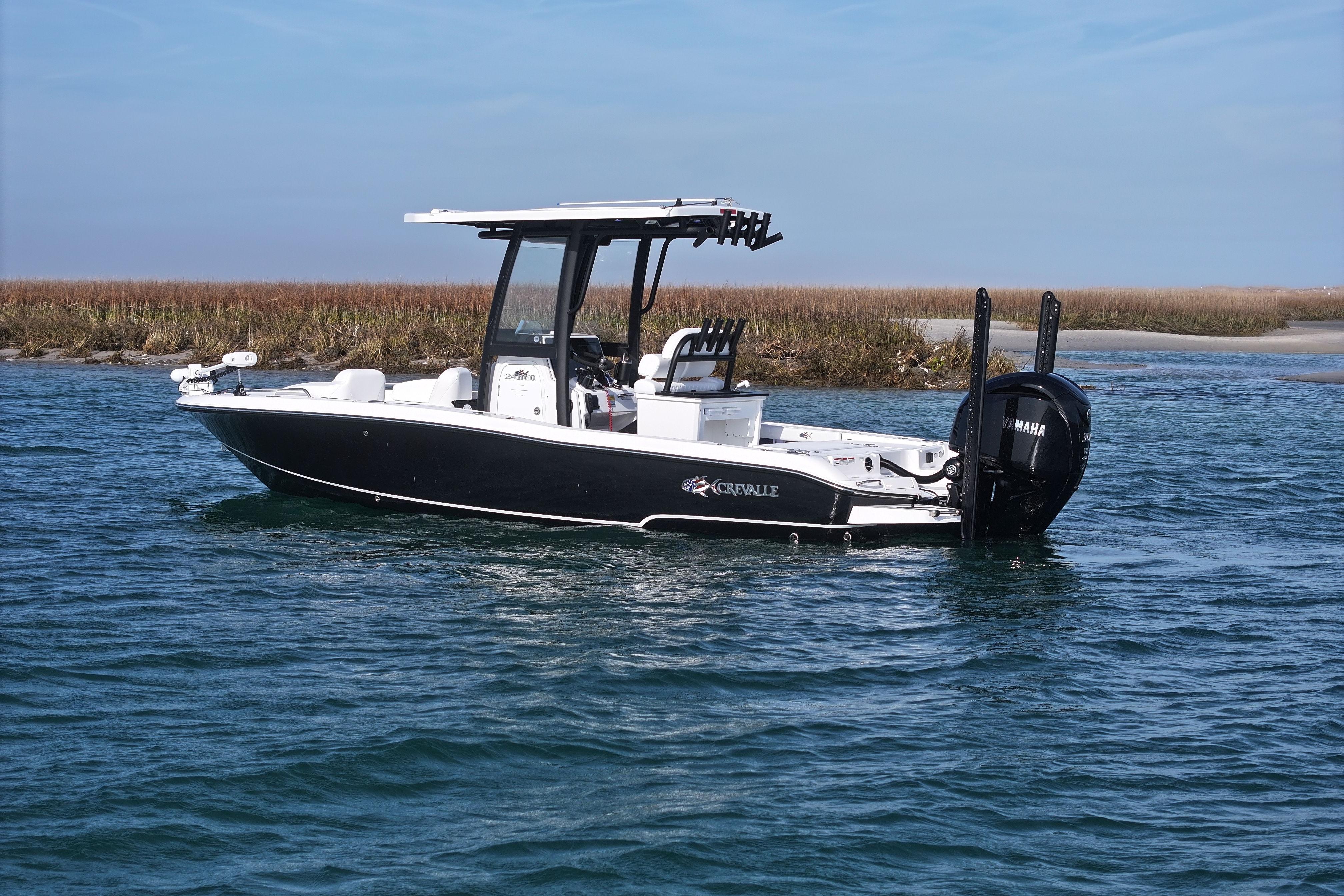 2025 Crevalle 24 HCO boat on water, featuring sleek design and Yamaha engine.