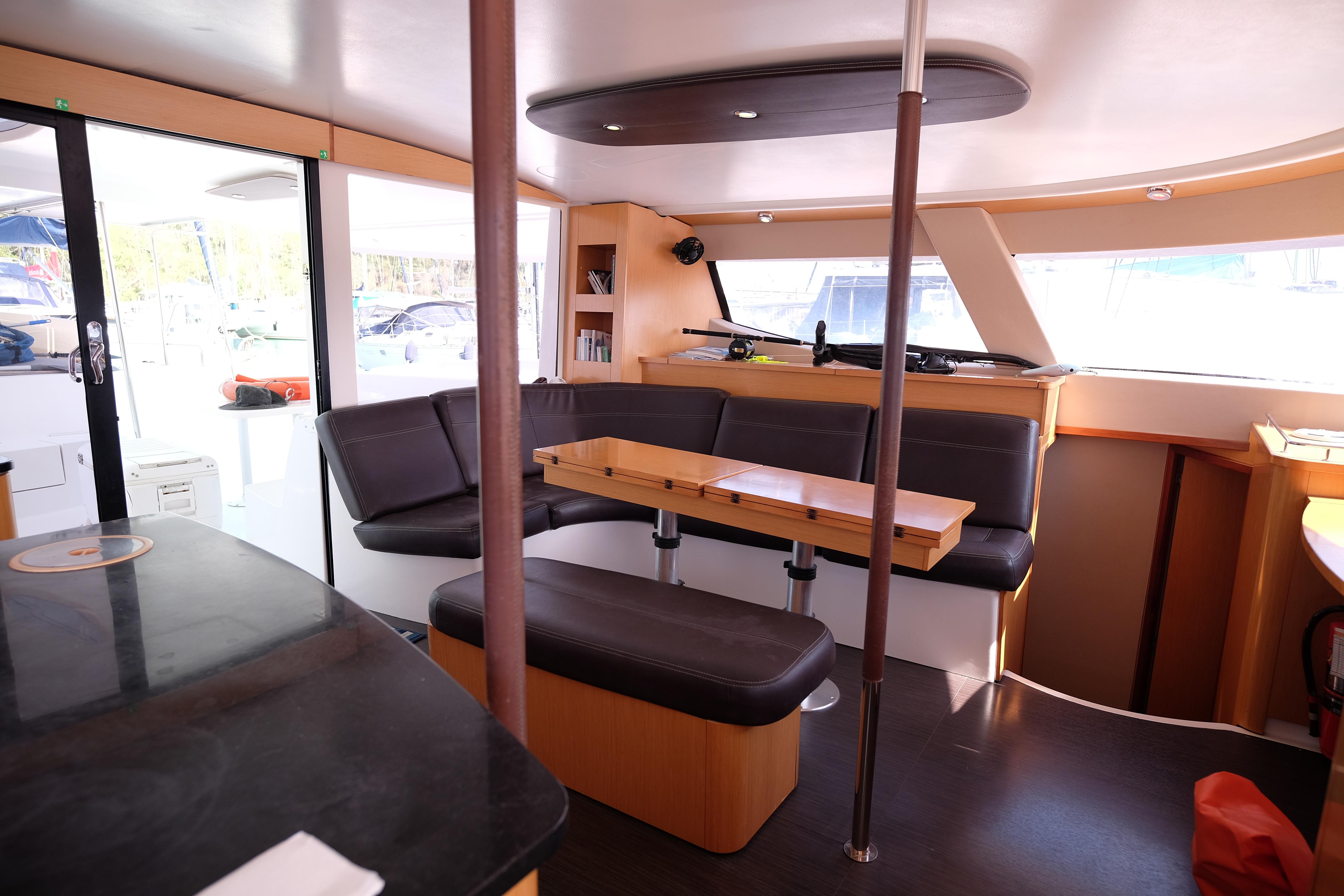 Interior of 2013 Fountaine Pajot Salina 48 Evolution catamaran with modern seating and dining area.