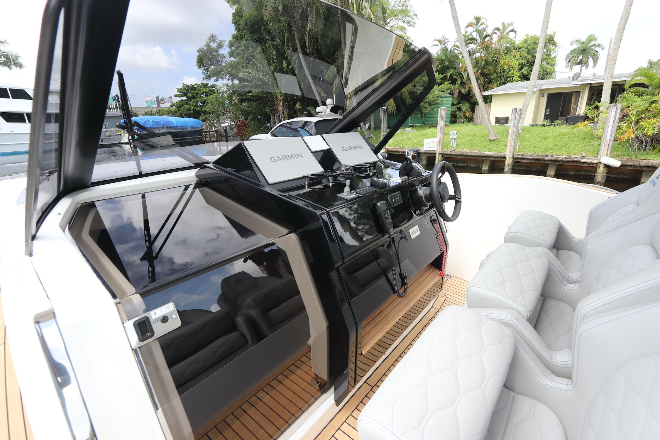 2024 Astondoa 377 Coupe Outboard helm with modern controls and luxurious seating.