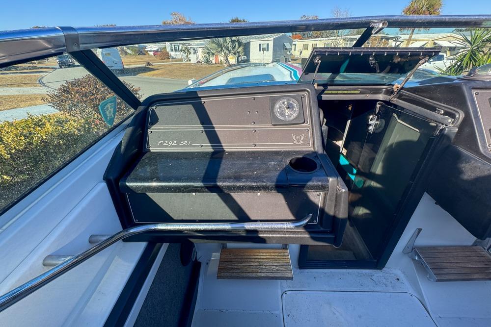 1989 Formula 292 SR-1 boat interior with dashboard and open compartment.