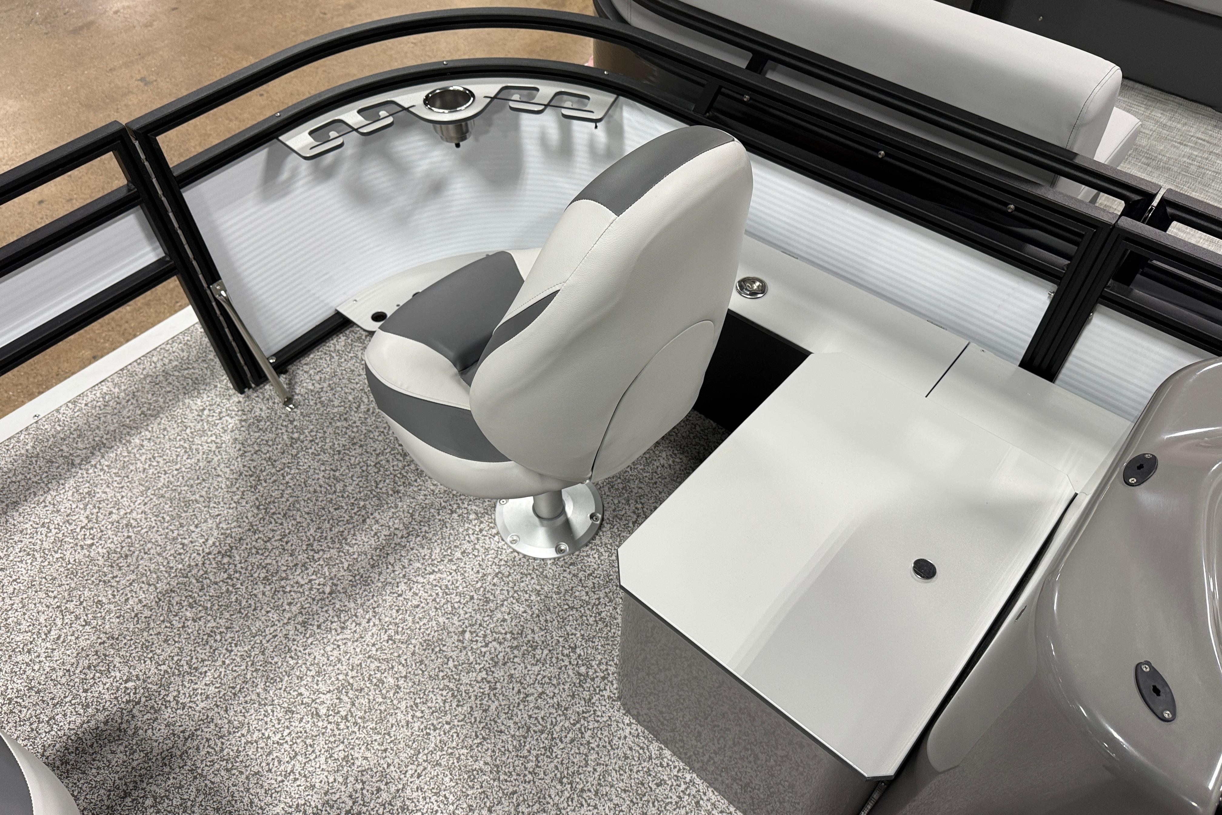 Interior of 2026 Angler Quest 816 Panfish boat with seating and storage.