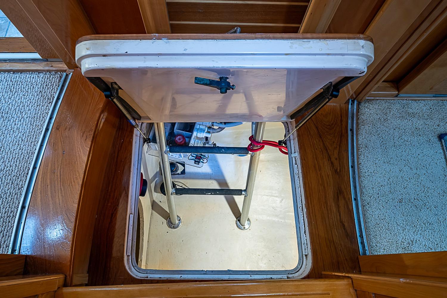 Hatchway with ladder on 2003 Magna Marine Nova Scotia 47 boat interior.