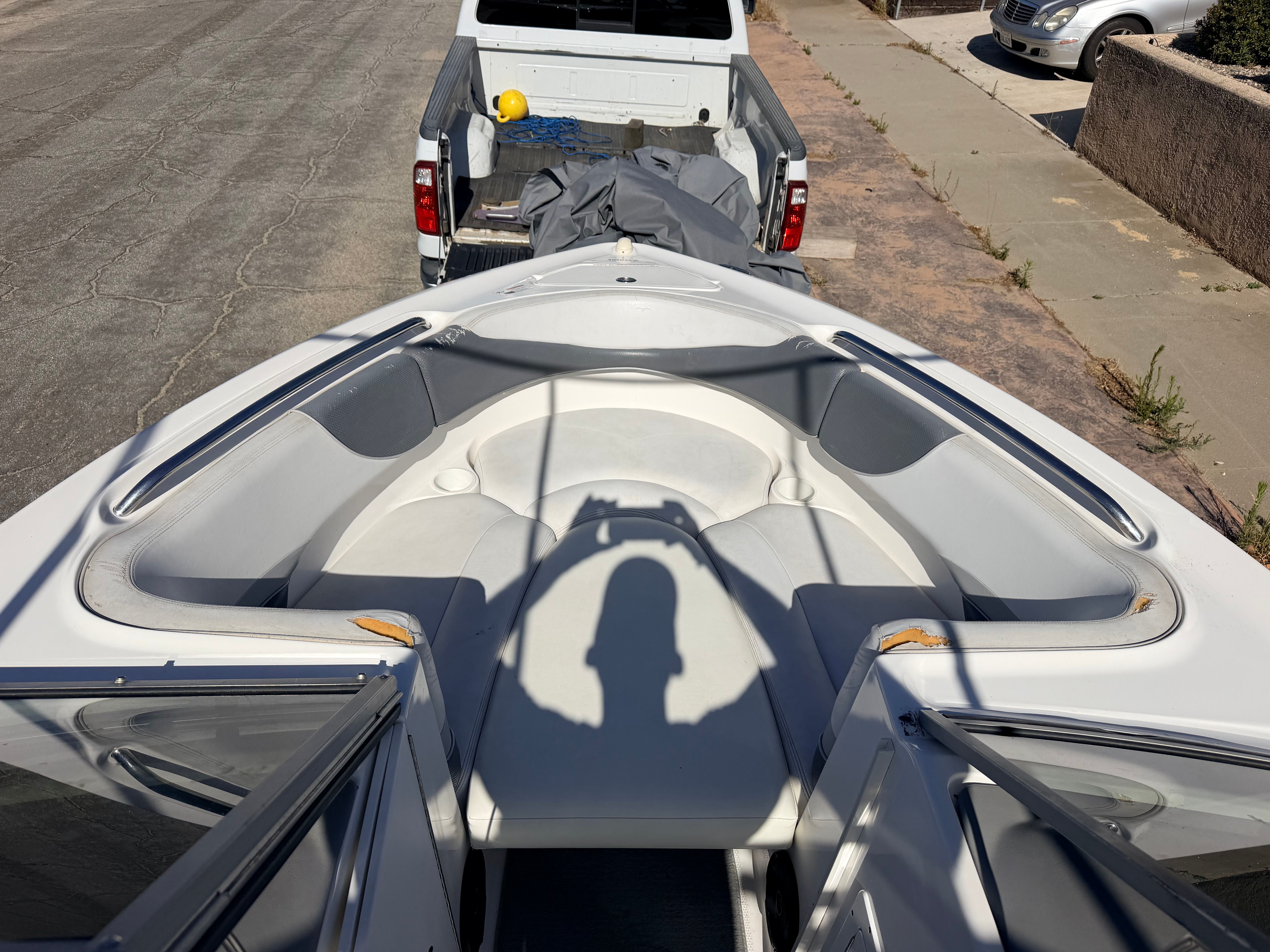 The image shows the bow seating area of a 2005 Yamaha AR230 boat on a trailer.