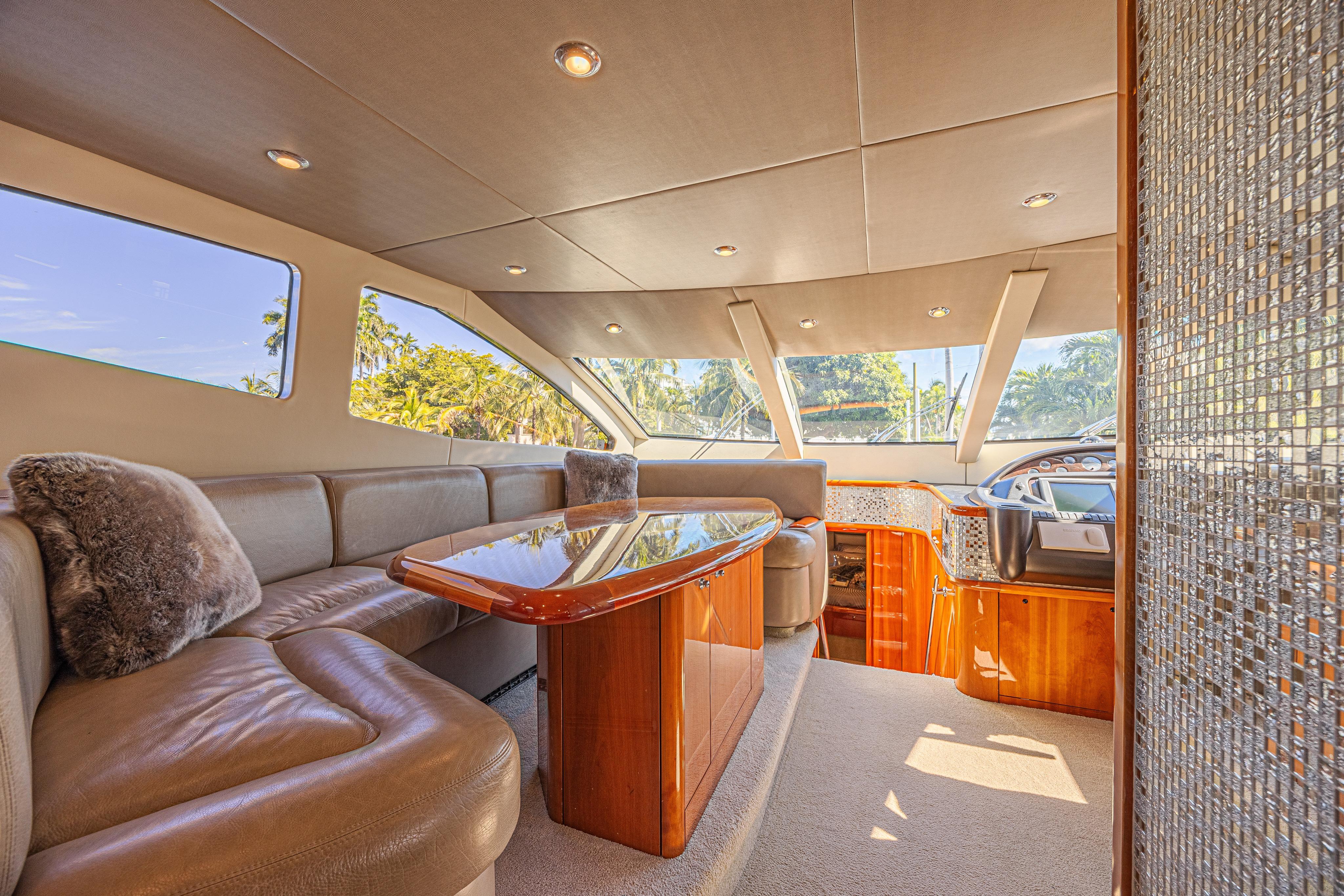 Luxurious interior of a 2006 Sunseeker 75 Yacht with plush seating and elegant design.