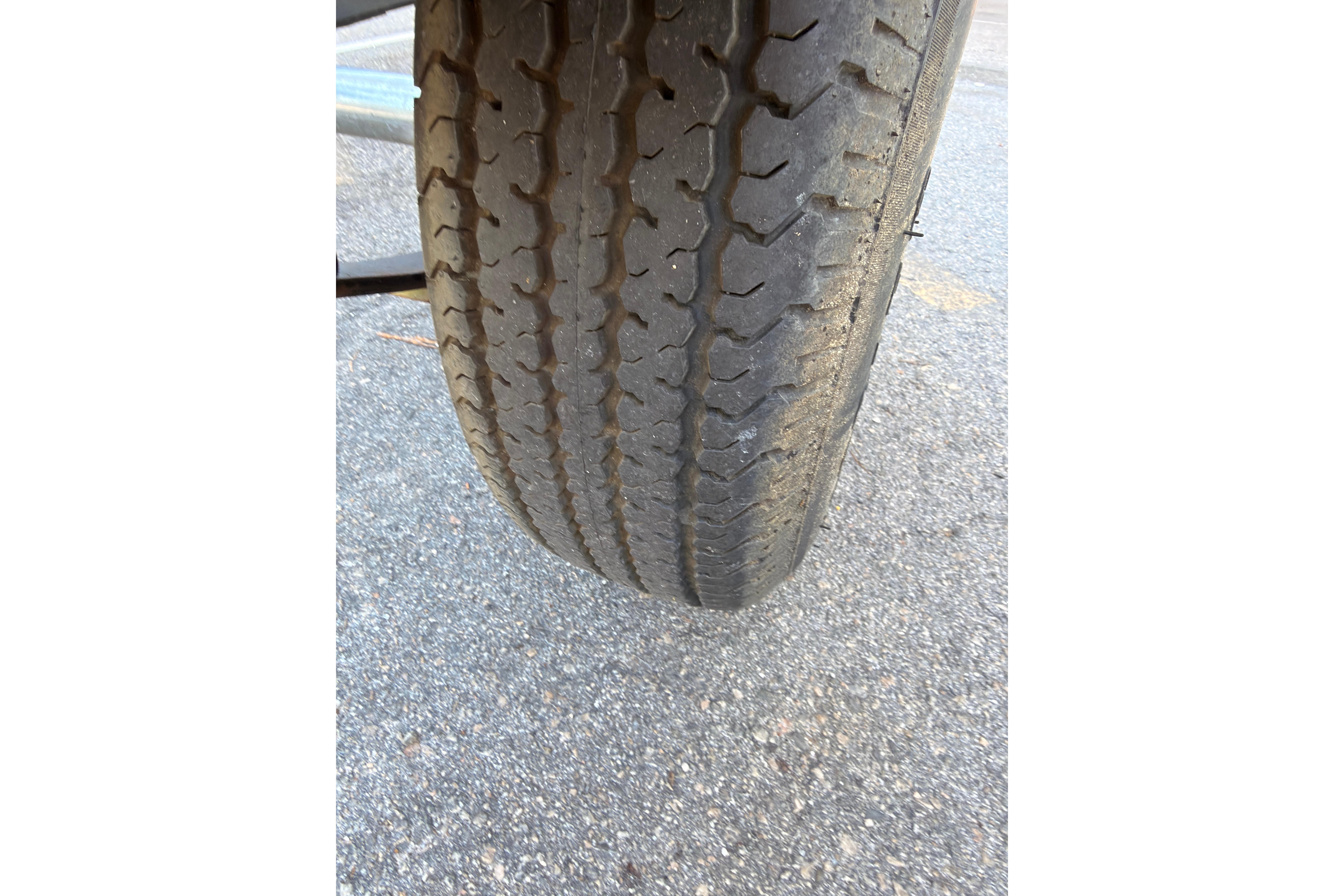 Close-up of a worn tire on a 2022 Tahoe T18 vehicle.