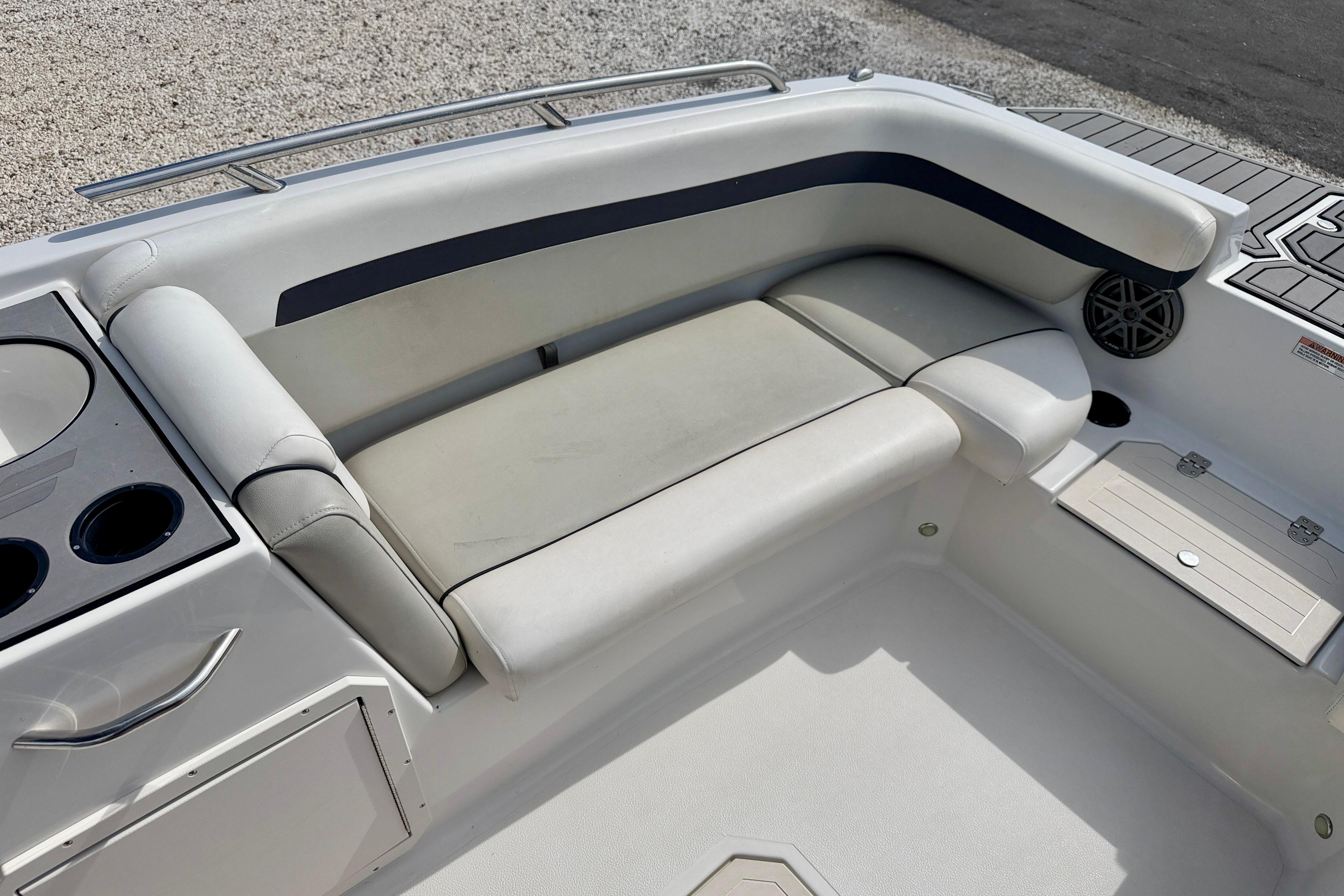 2021 Starcraft SVX 191 OB boat interior with cushioned seating and cup holders.