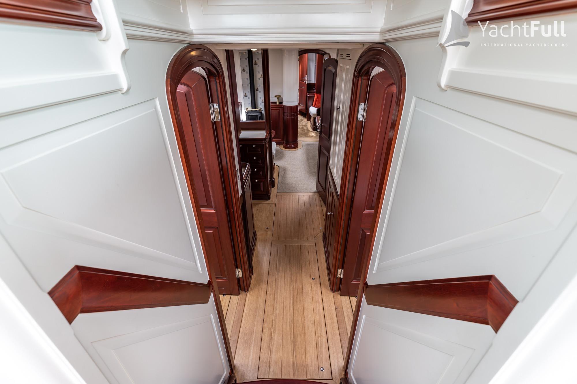 Luxurious interior of 2025 Dykstra 73 yacht with elegant wood finishes.
