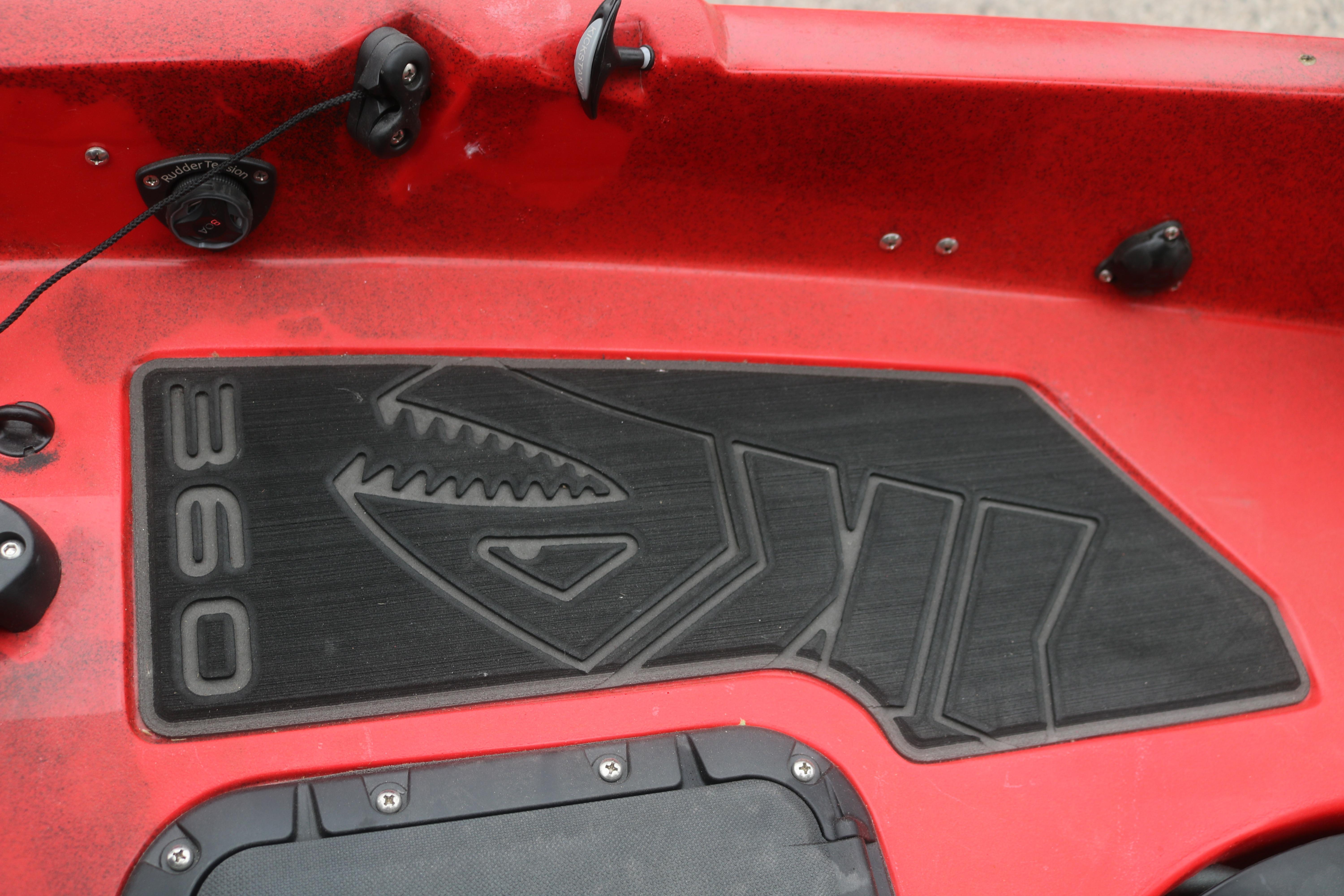 Red 2023 Hobie Mirage Pro Angler 14 kayak with black non-slip deck pad.