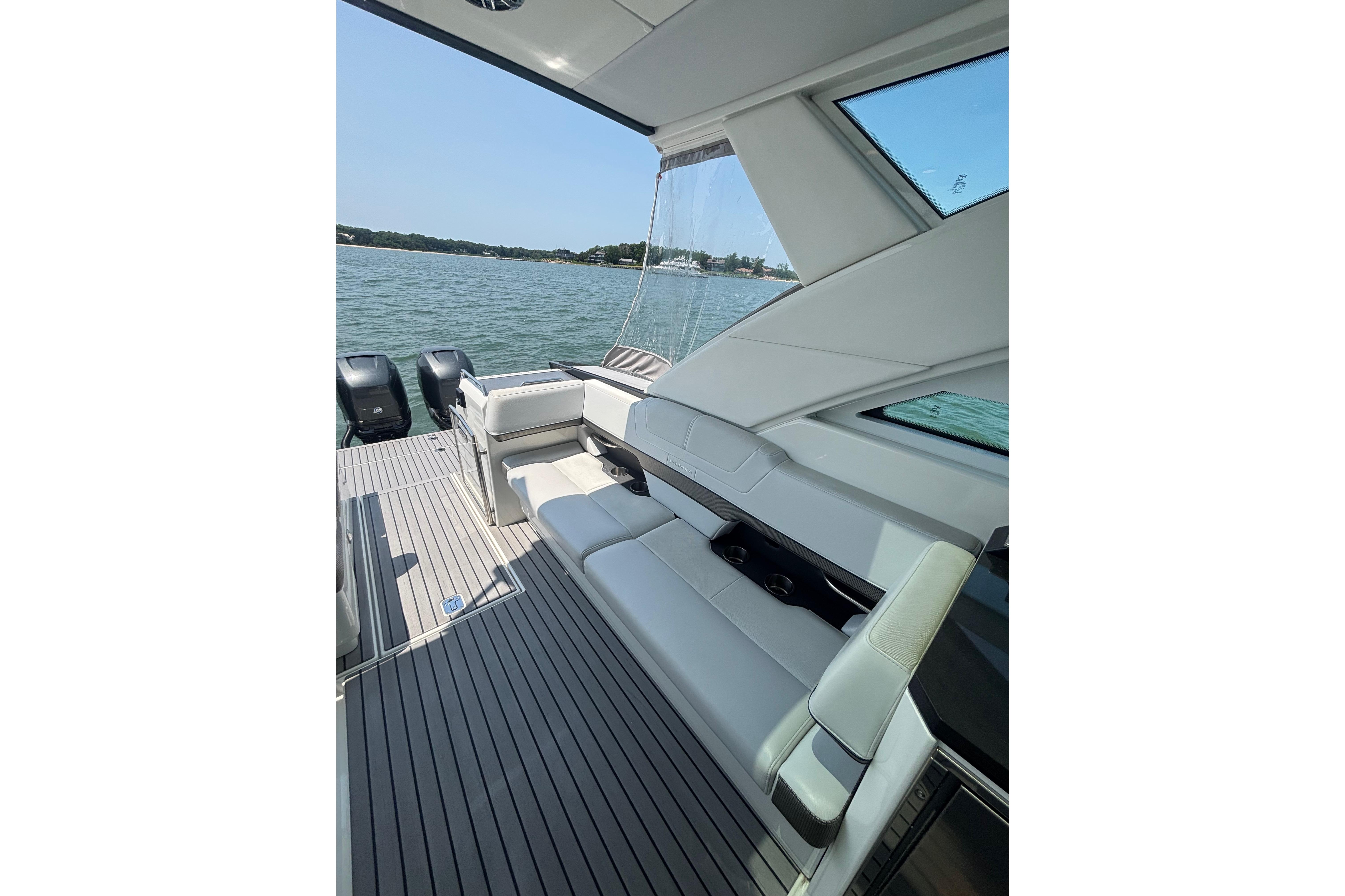 2019 Formula 430 Super Sport Crossover boat interior with seating, overlooking water.
