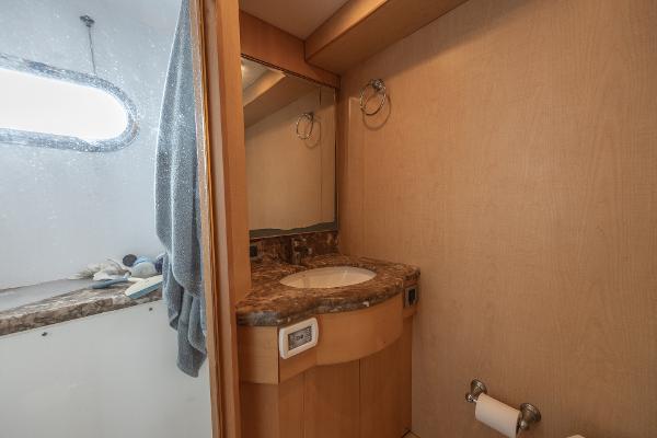 2001 Grand Harbour 76 yacht bathroom with marble countertop and mirror.