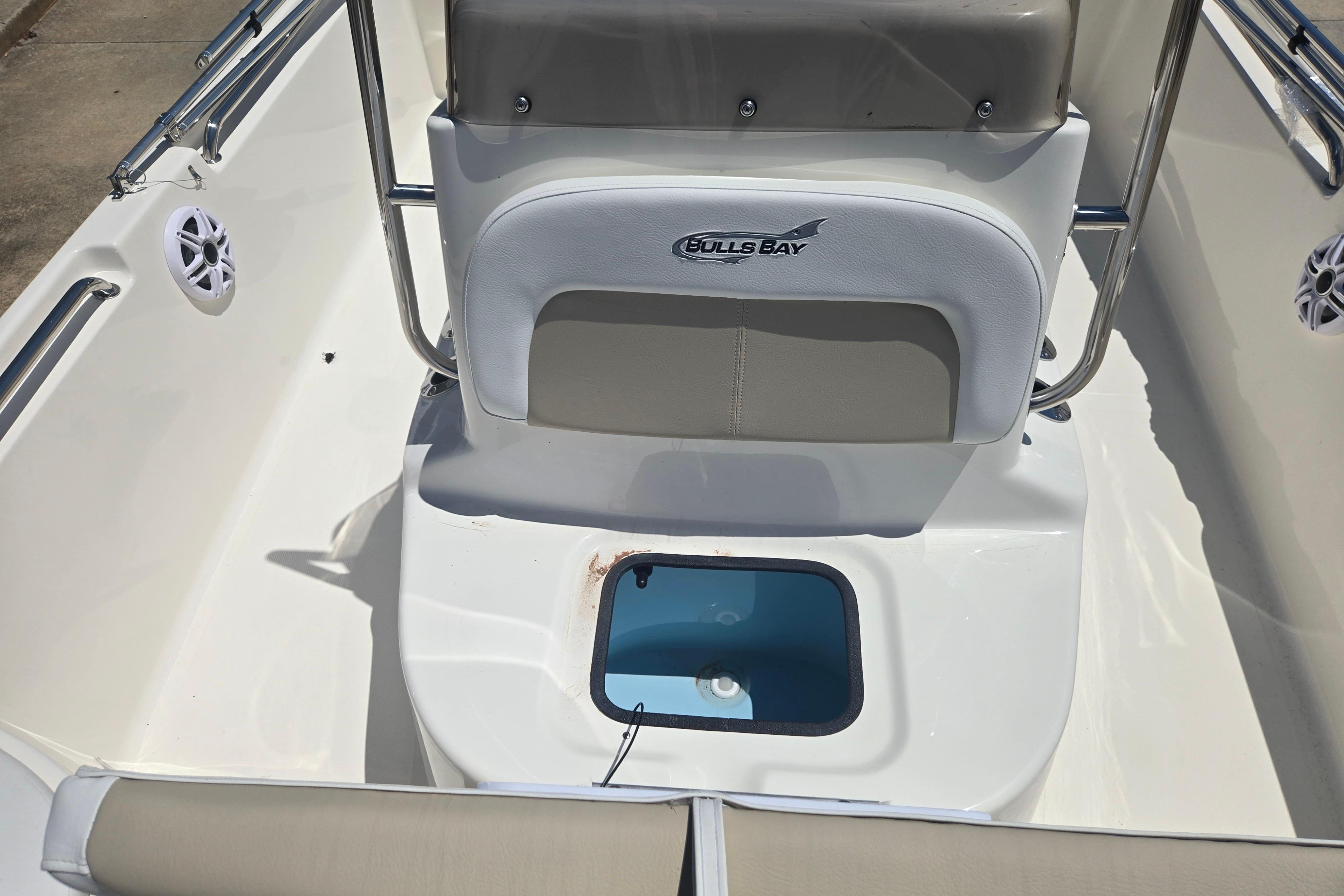 2026 Bulls Bay 2000 boat interior with seating and storage compartment.