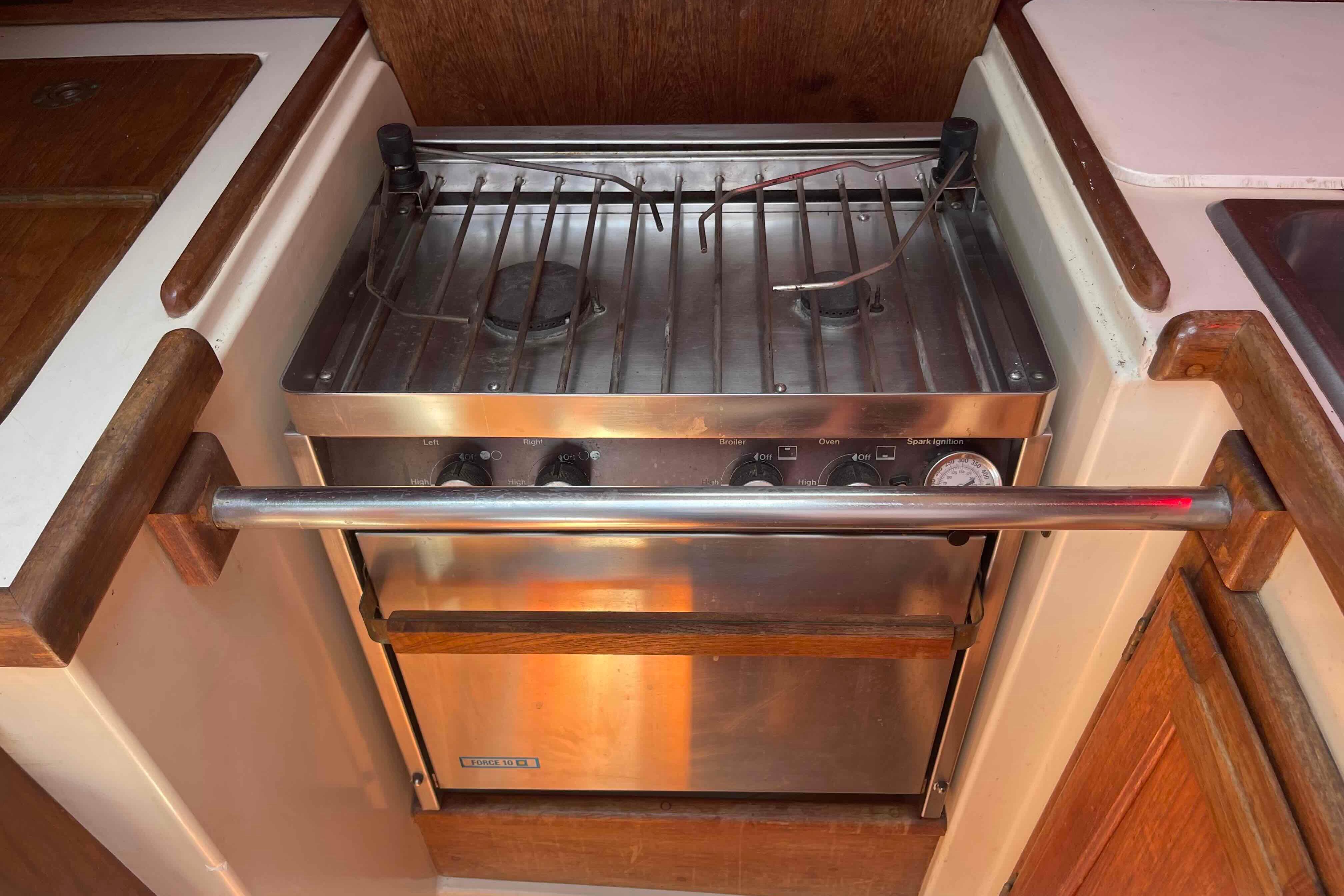 Stainless steel stove in 1987 Pacific Seacraft 34 yacht kitchen.