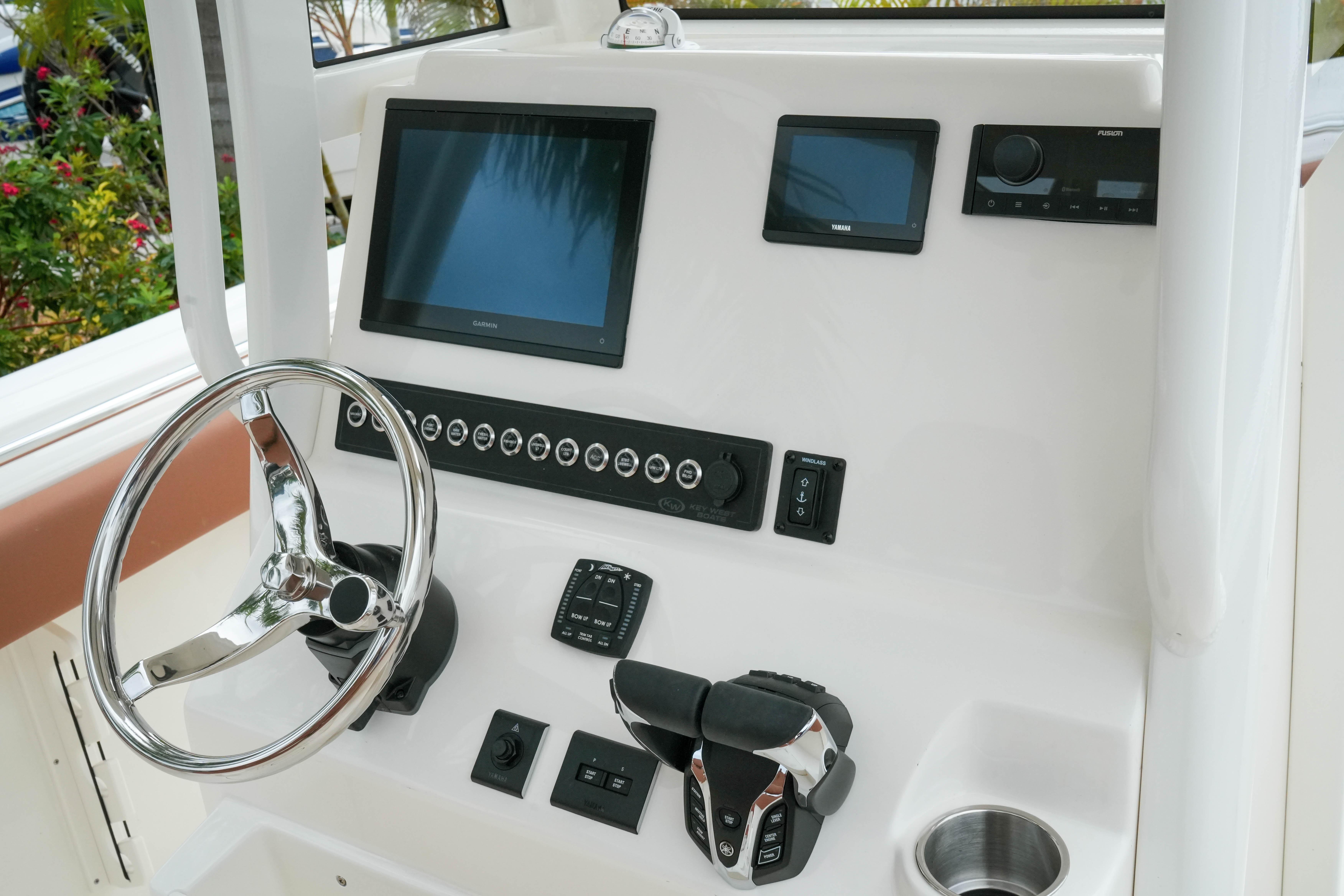 Helm of 2026 Key West 244 Center Console with modern controls and displays.