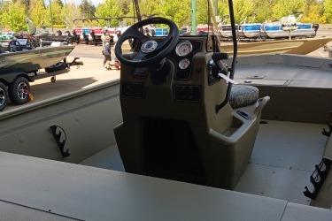 2026 Tracker Grizzly 1860 CC boat interior with steering console and gauges.