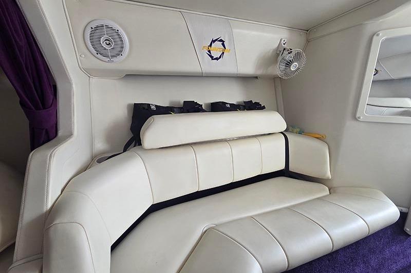 Interior of a 2004 Fountain 38 Lightning boat with white leather seating.